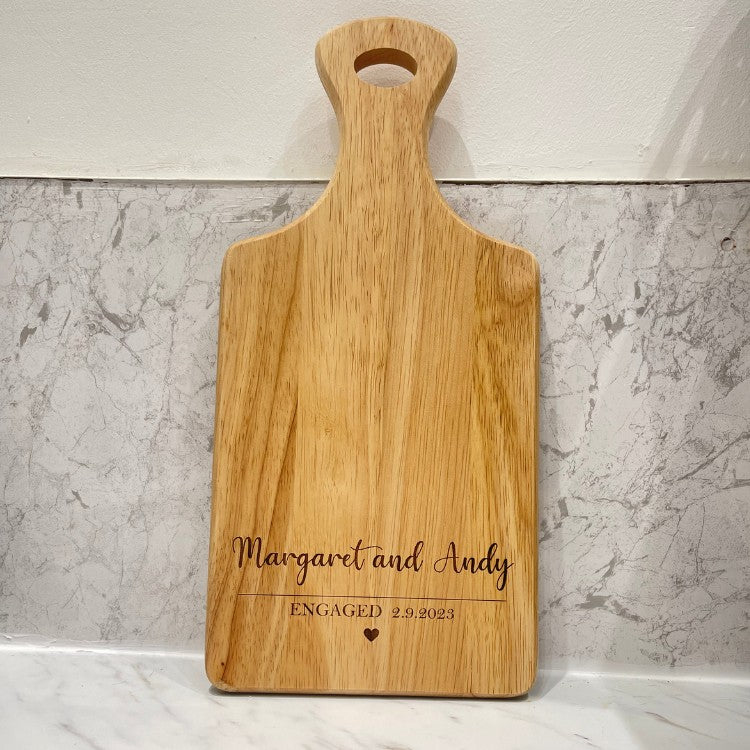 Serving board engraved with text engagement gift with heart