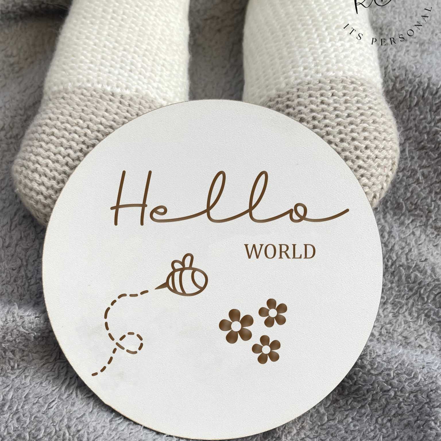 Baby Announcement Plaque with Bee Design: Durable and elegant "Hello World" wooden disc with a delightful bee and flower motif, ideal for baby photo shoots. - Rowland Designs