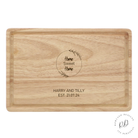 A wooden chopping board engraved with 'Home Sweet Home'. Ideal for new homeowners, this personalized kitchen accessory combines functionality with sentimental value, crafted from durable high-quality wood to last as a cherished keepsake. Personalise at bottom with 2 lines of text.