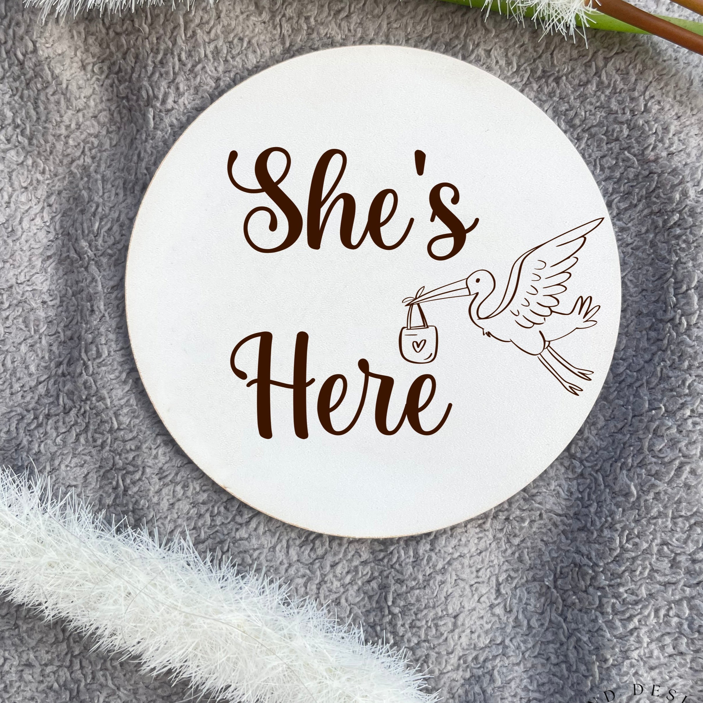 Newborn Welcome Plaque – 'She’s Here' Baby Announcement Plaque, made from durable veneer or MDF, perfect for baby shower gifts and newborn keepsakes.