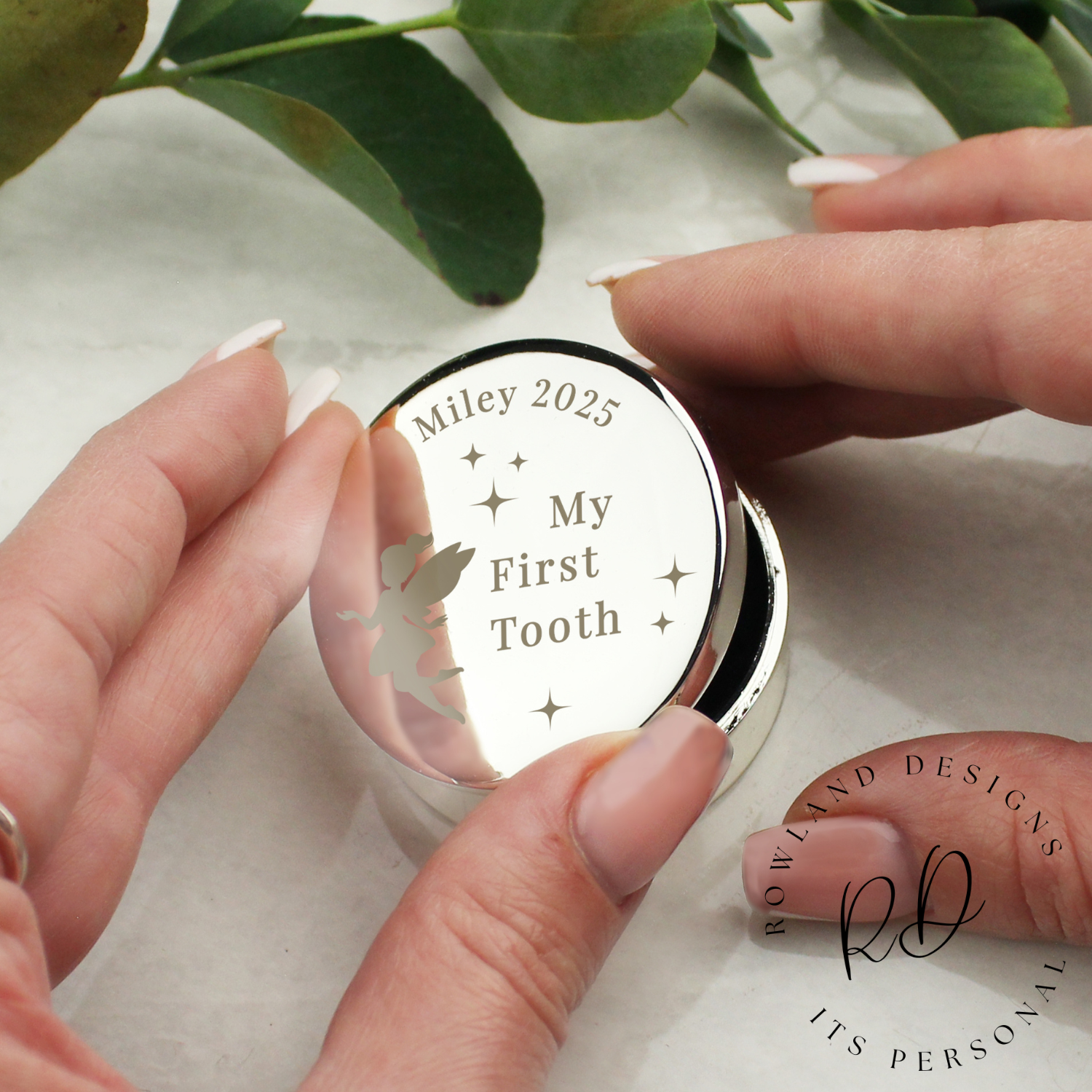 Close-up of personalised trinket box for baby’s first tooth