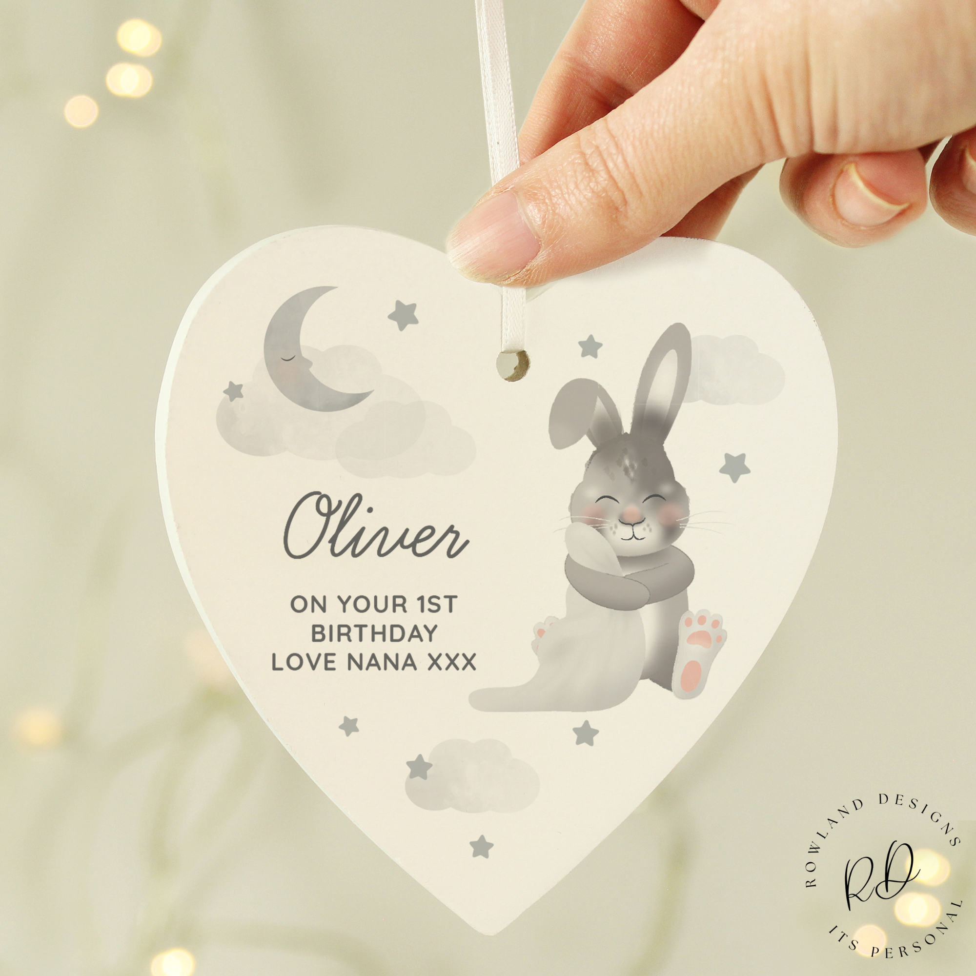 Wooden baby keepsake with name and ribbon