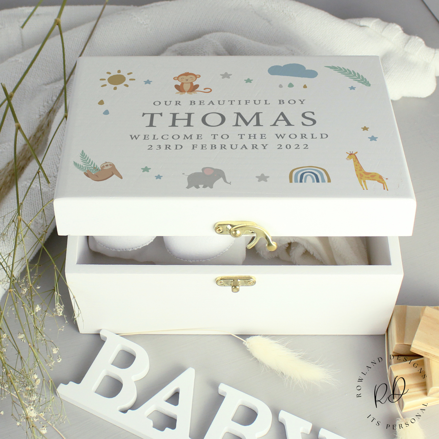 Close-up of custom text on safari-themed baby memory box