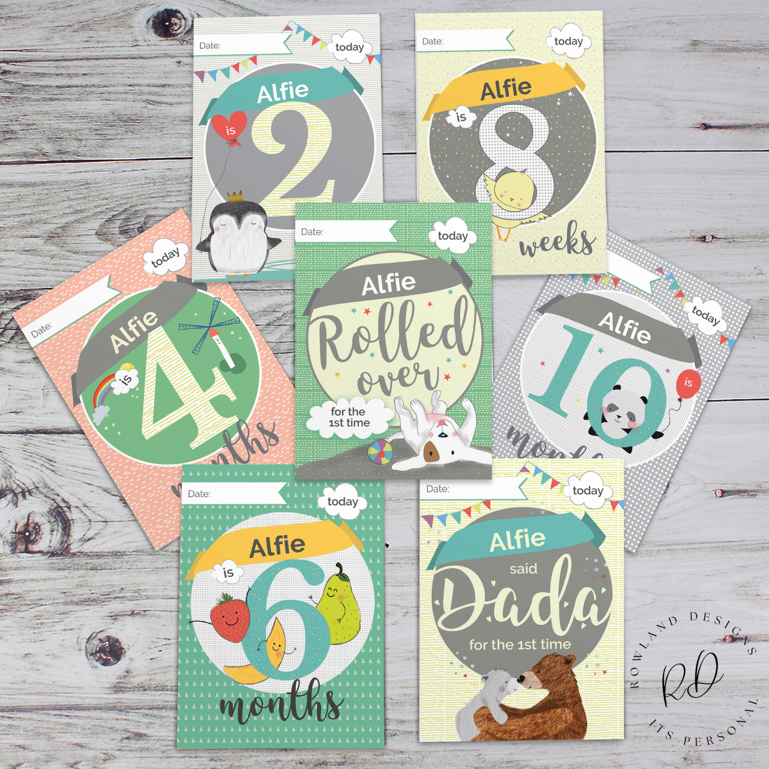 Set of 24 personalised baby milestone cards displayed on table