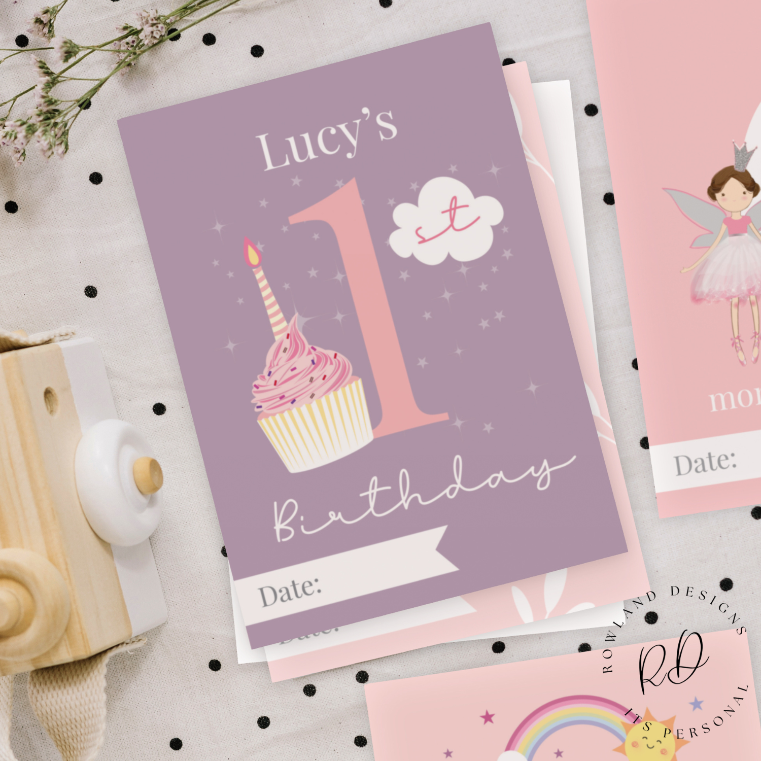 Baby holding personalised milestone card for first smile