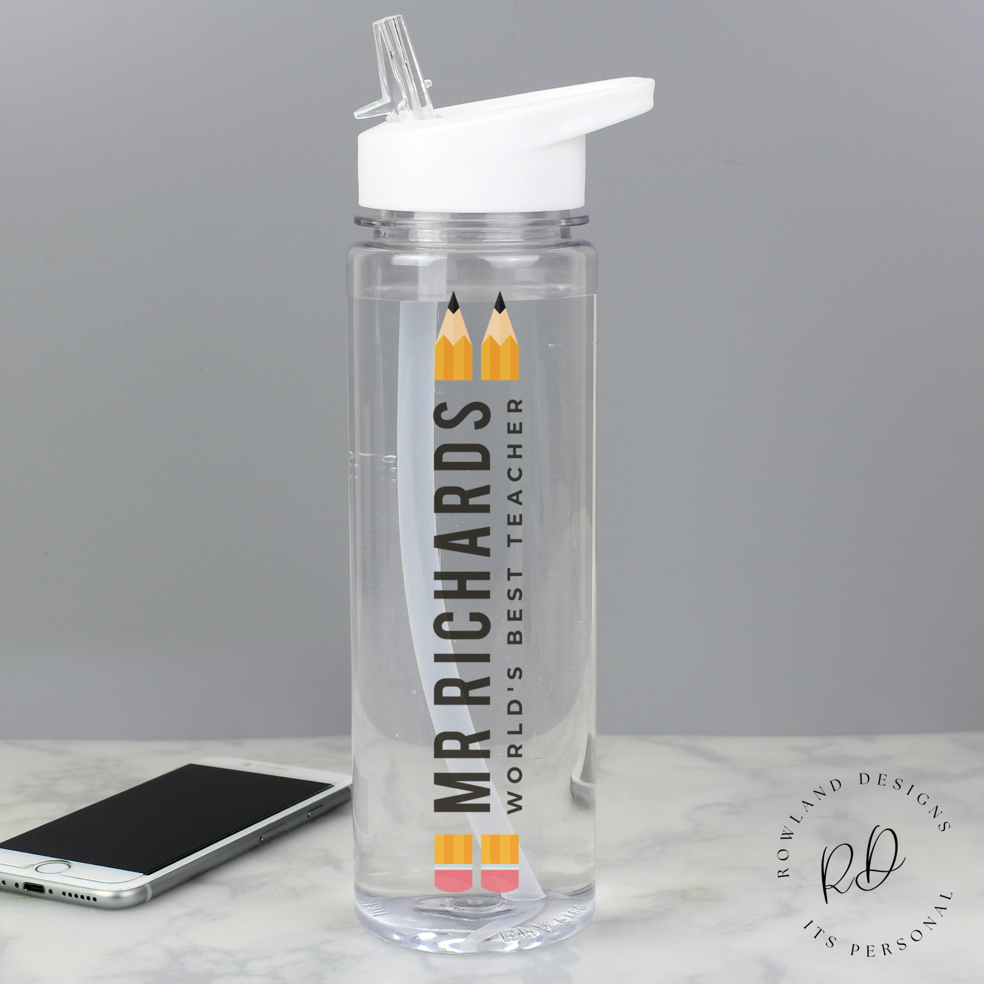 Custom name teacher gift water bottle on classroom desk – white bottle with carry loop and straw