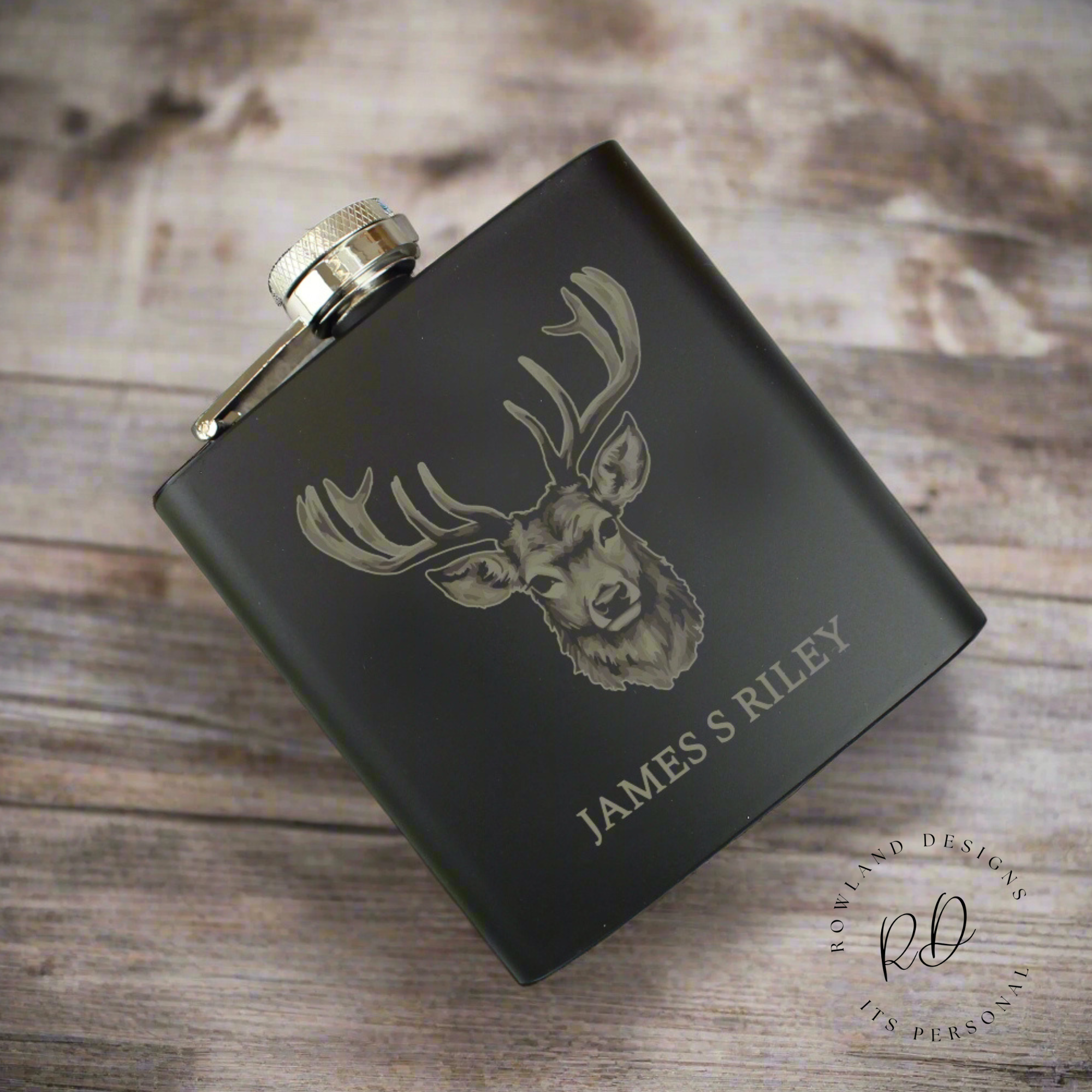 Close-up of personalised name engraving on hip flask.