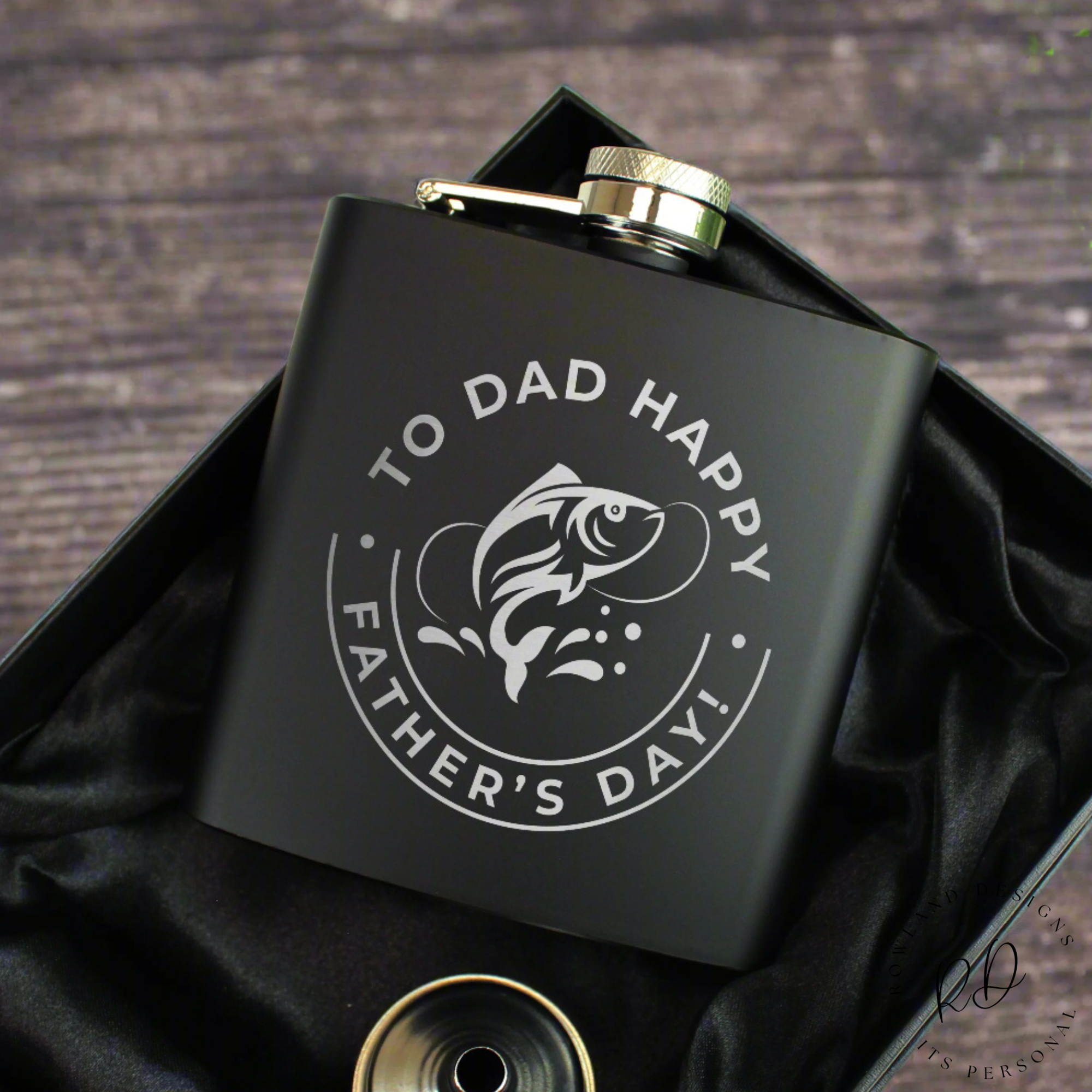 Fishing-themed personalised hip flask in a silk-lined gift box.