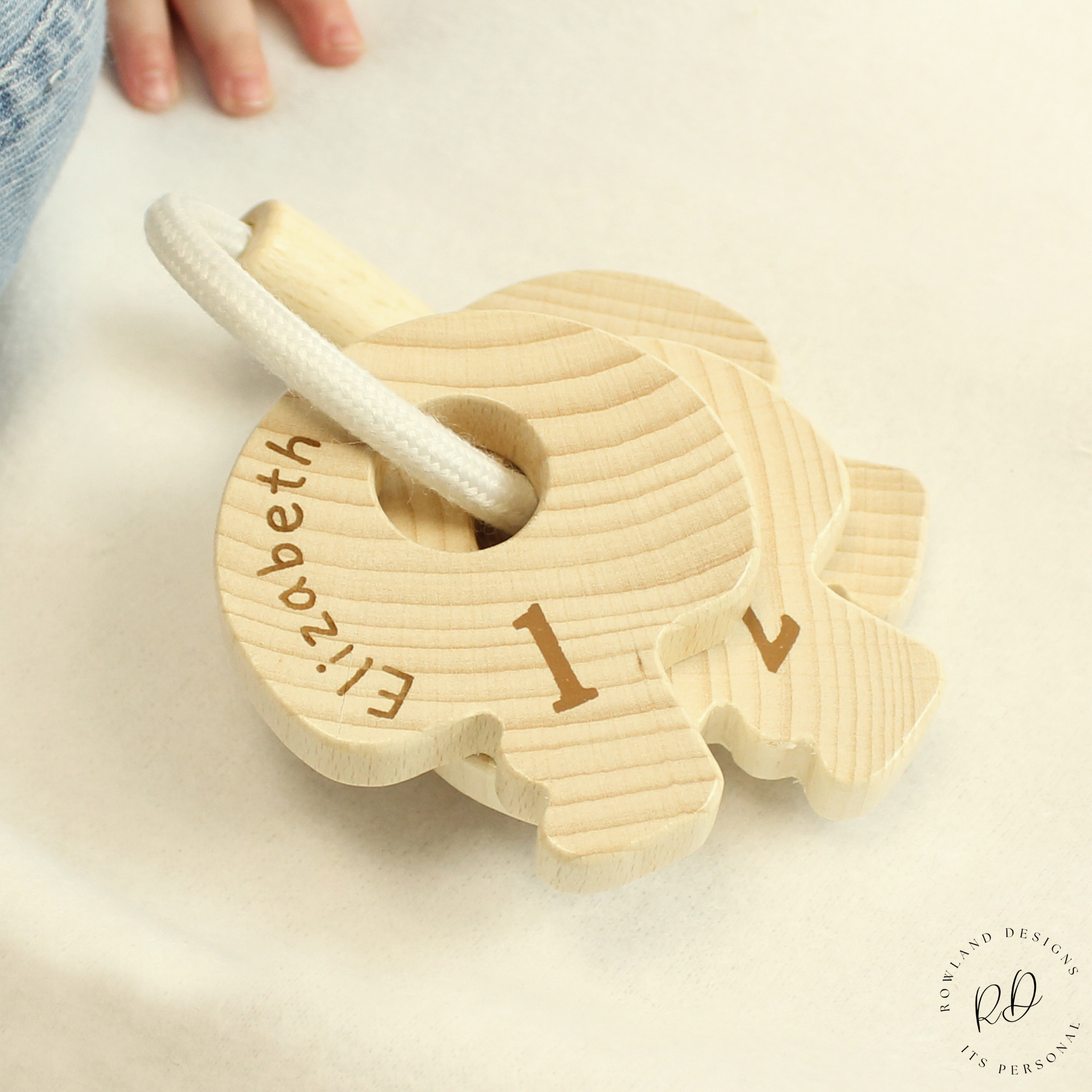 FSC certified baby toy with name on key