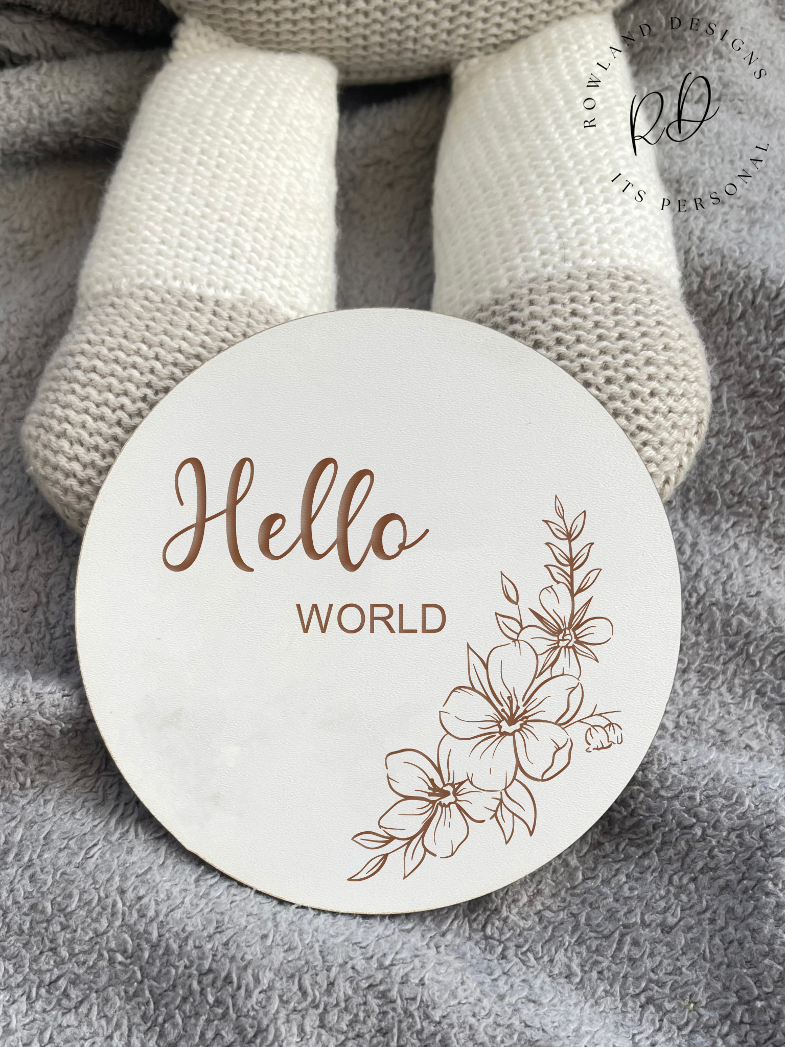 The 10cm wooden 'Hello World' plaque photographed next to a Teddy to show the actual size and scale.