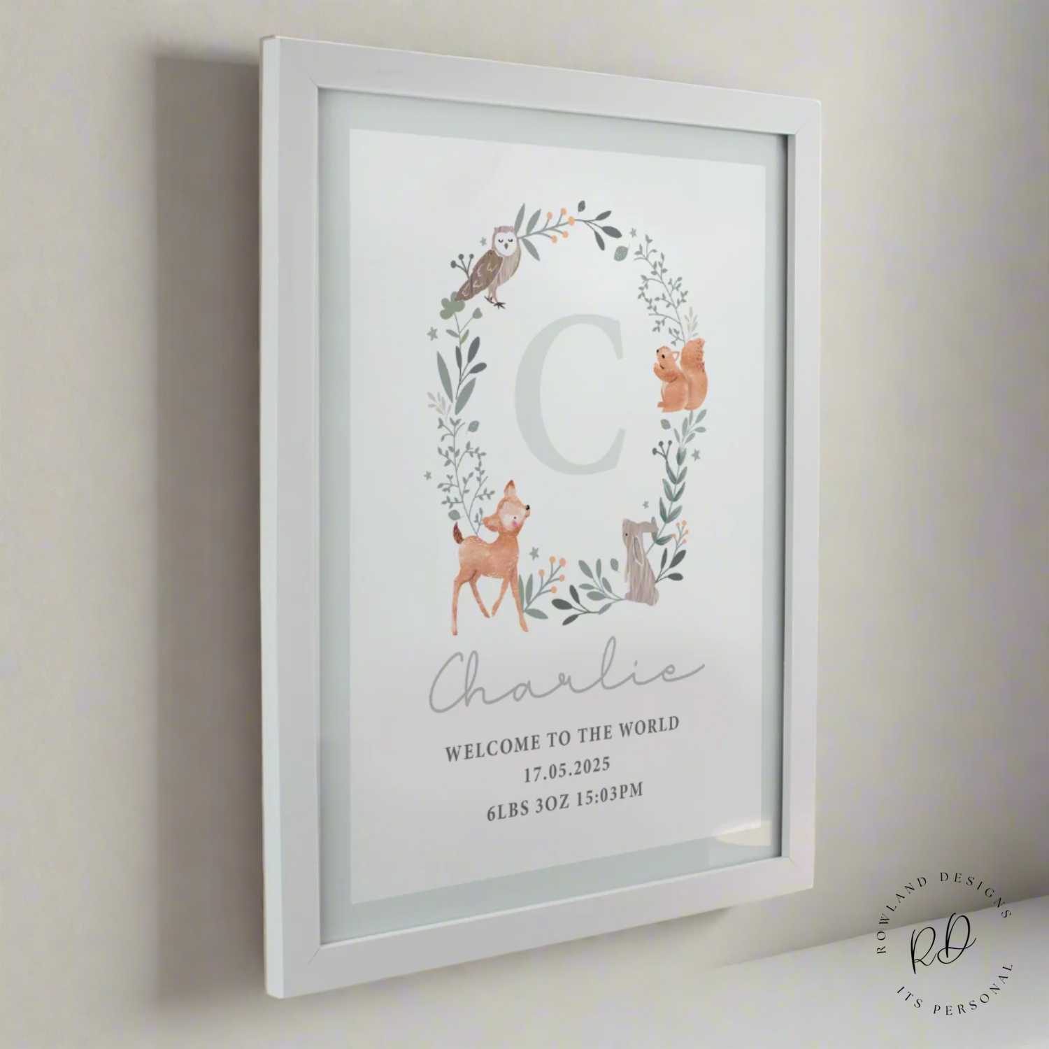 Woodland-themed nursery wall art personalised with initial and name in white poster frame
