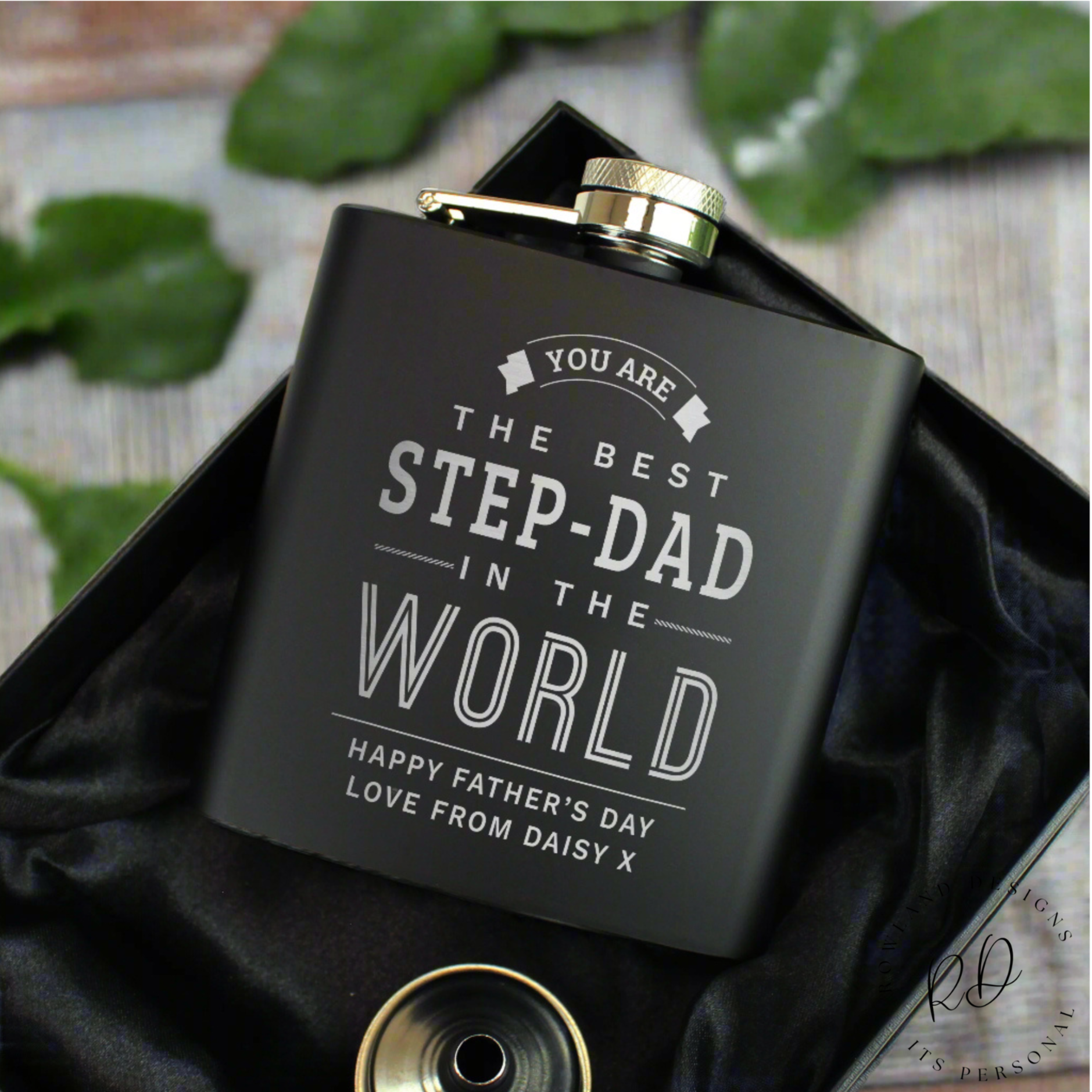 Personalised black hip flask in a silk-lined presentation box.