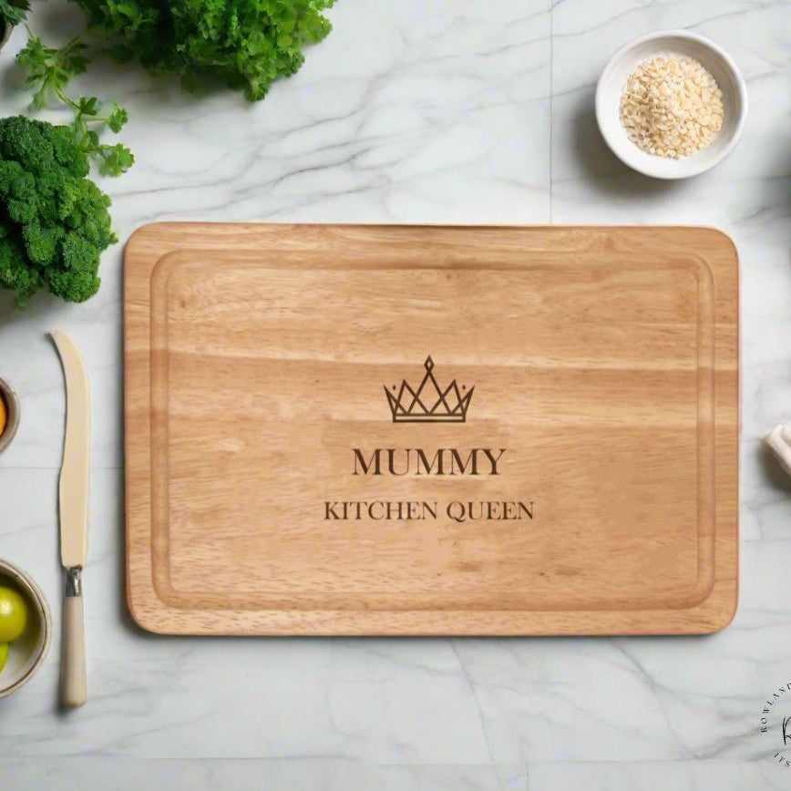 Personalised crown kitchen chopping board displayed on a kitchen counter