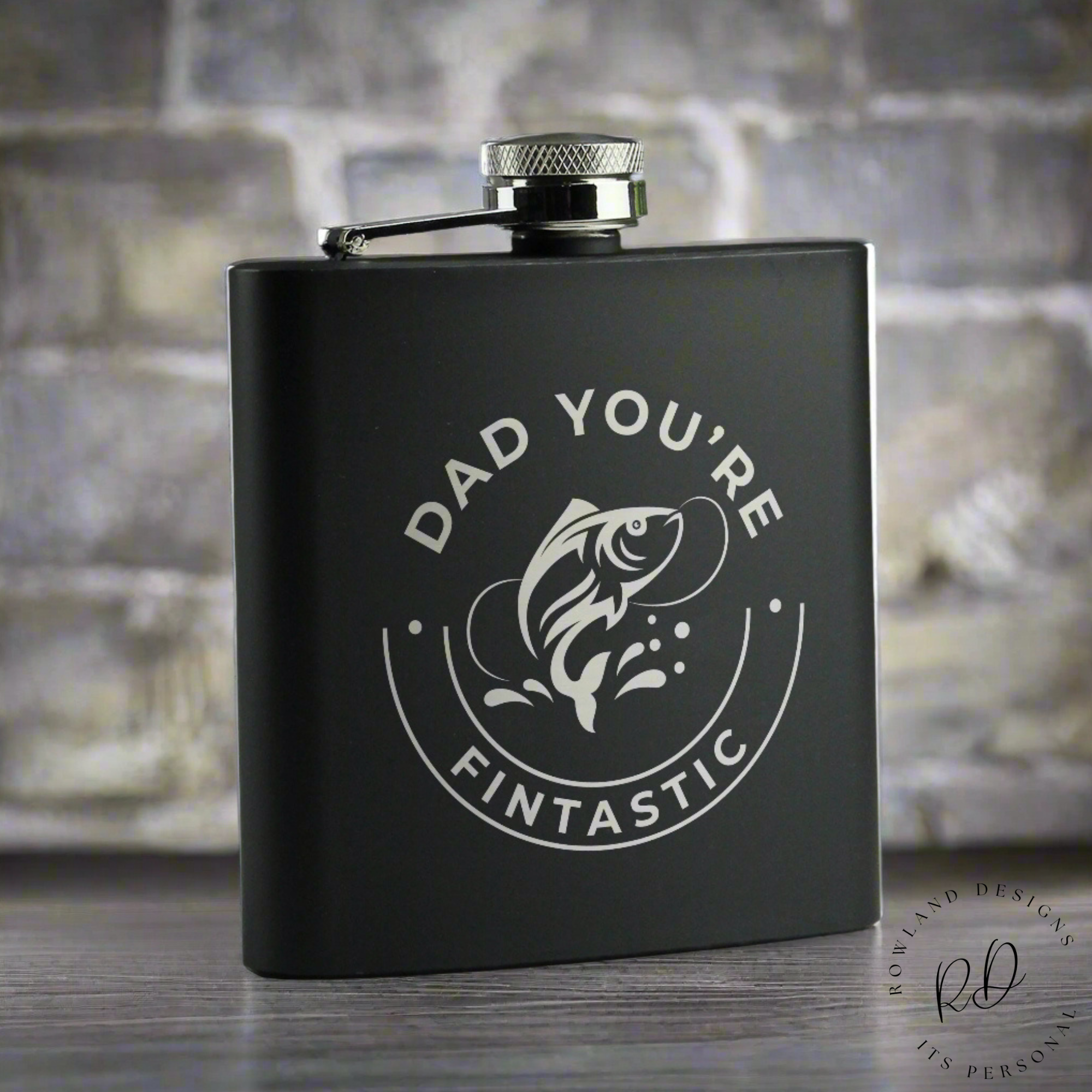 Personalised stainless steel fishing hip flask with custom engraving.