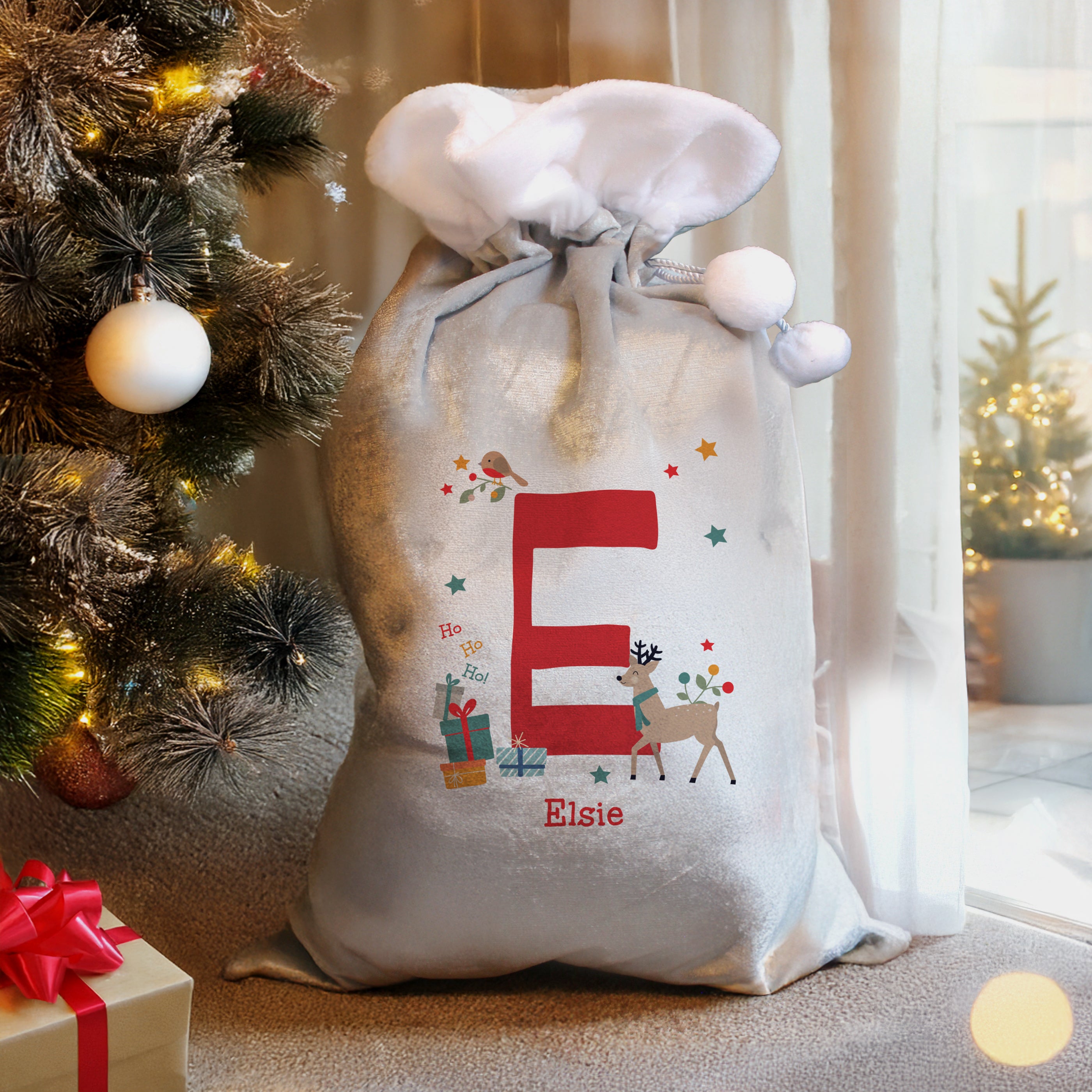 Full view of the large, personalised fleece Christmas sack with initial and name.