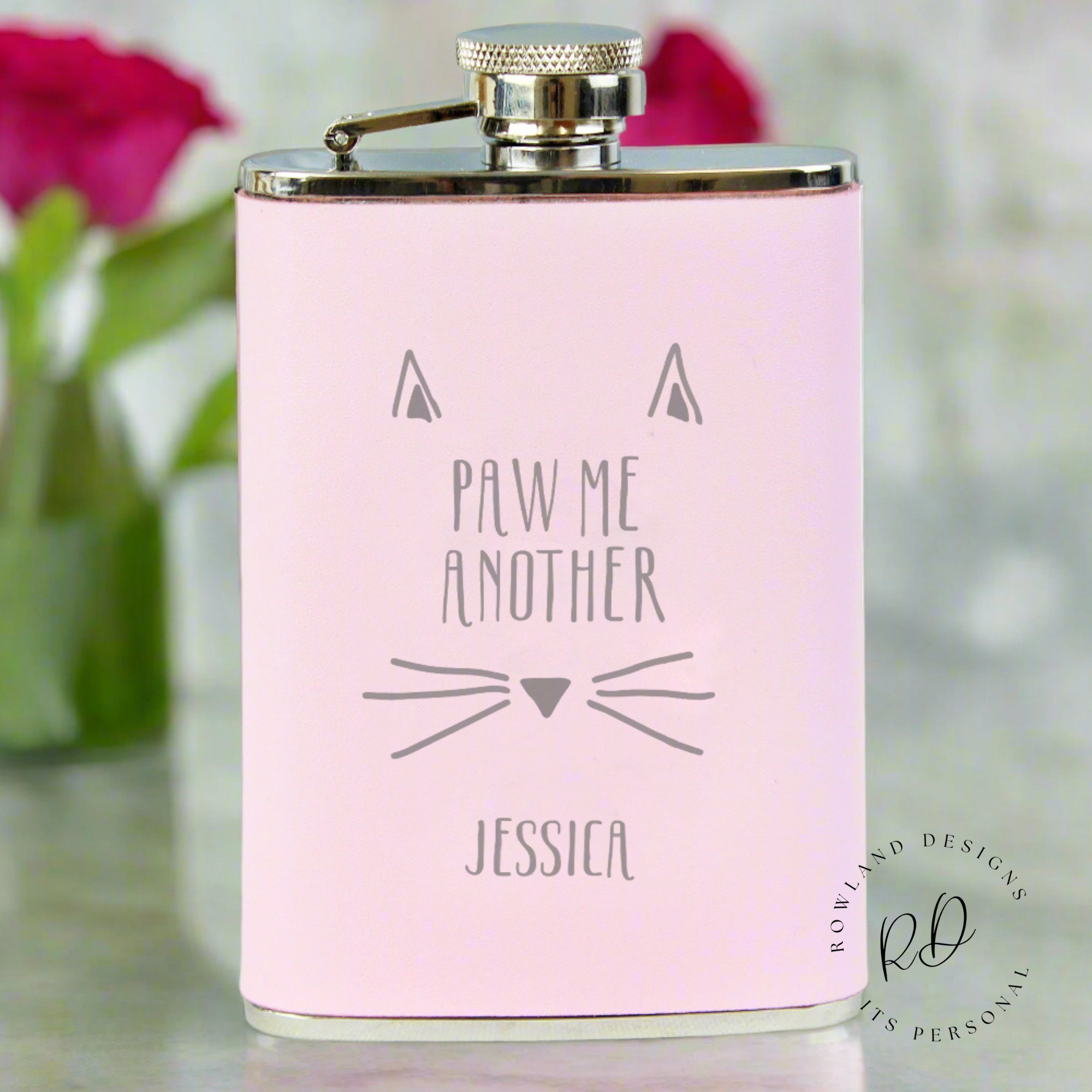 Luxury faux leather pink hip flask in a gift box.