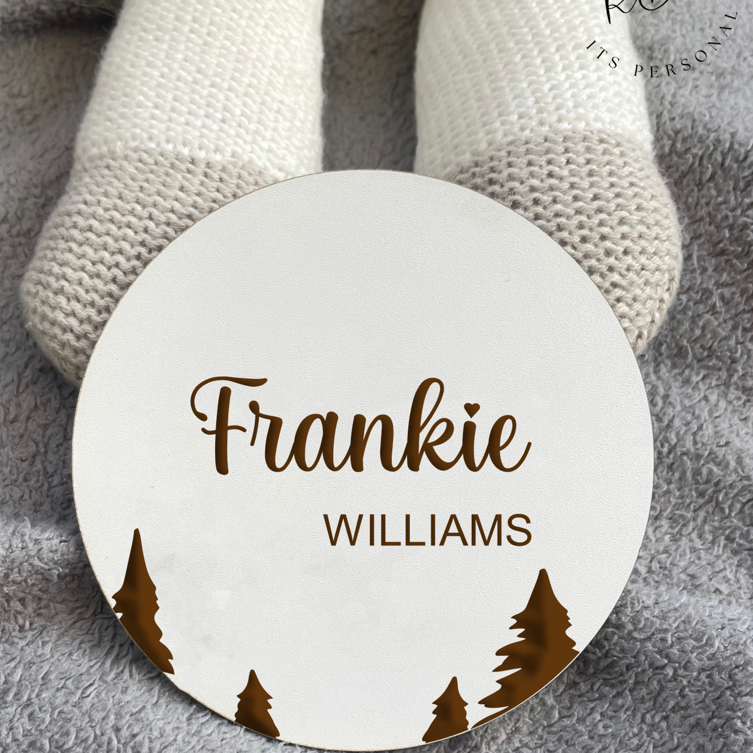 Custom white MDF baby name sign with a detailed tree silhouette engraving for newborn announcements.