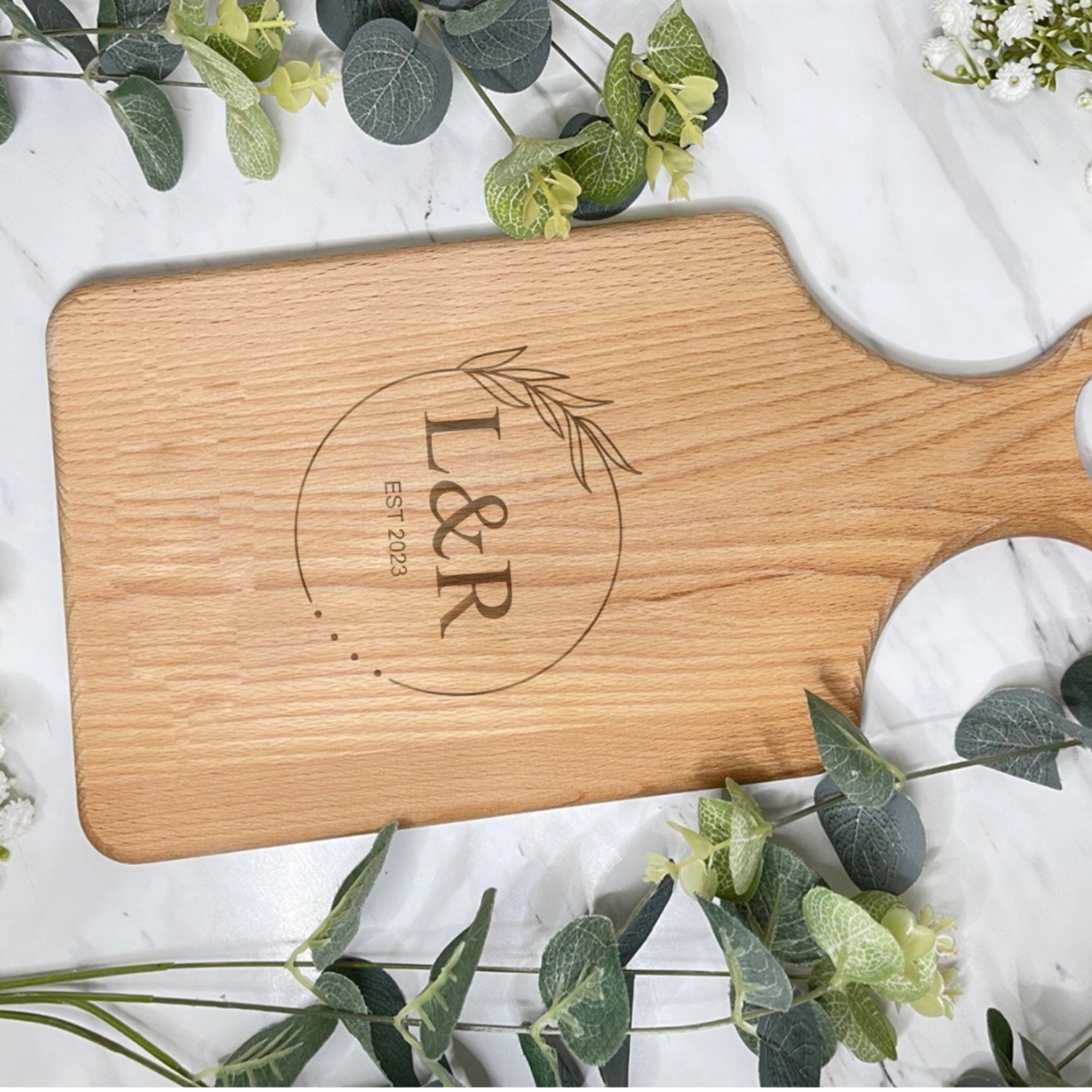 Close-up of leaf engraving on chopping board