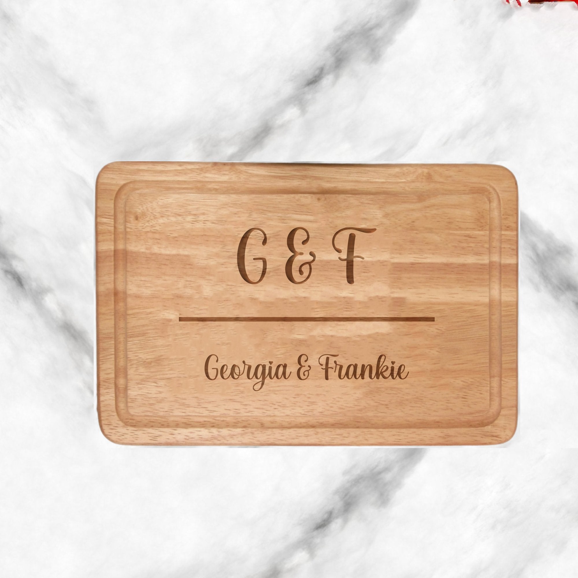 Wooden chopping board with own text on a marble background