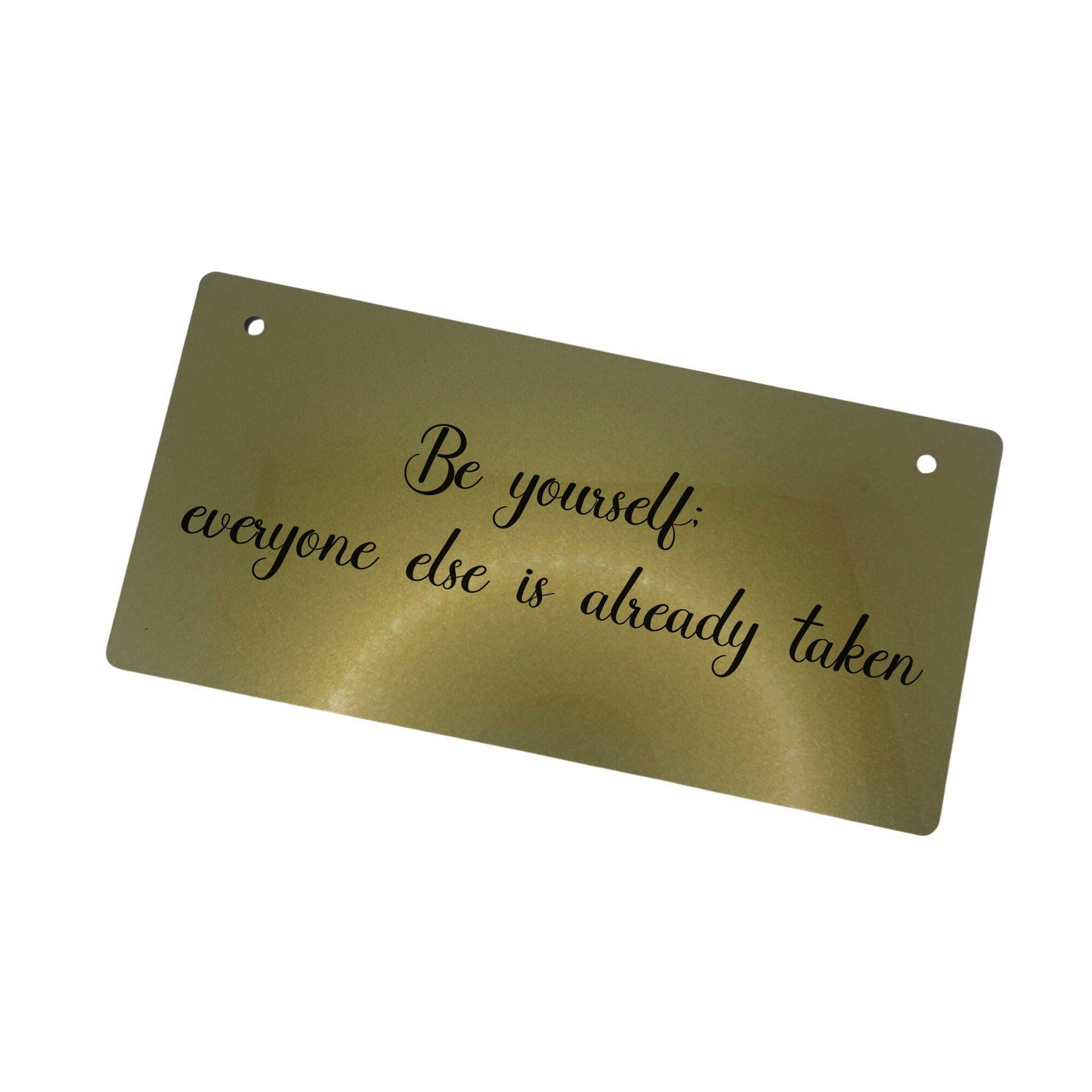 A stylish acrylic sign with an inspiring quote.