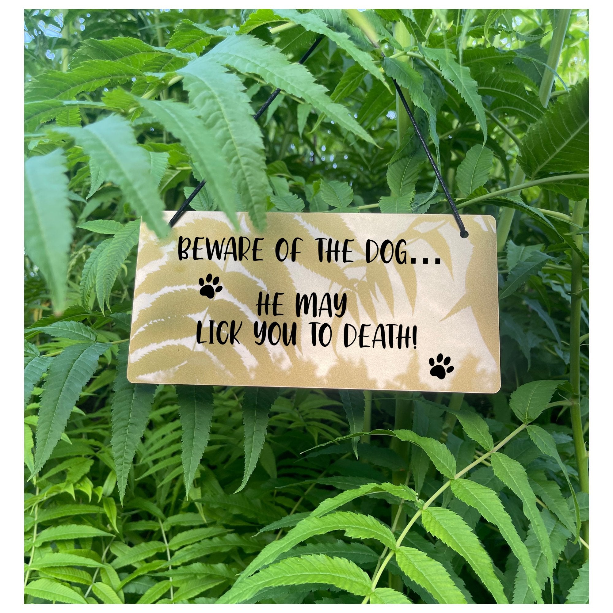 "Beware of the Dog" wall decor sign with a cute paw print, suitable for indoor use.