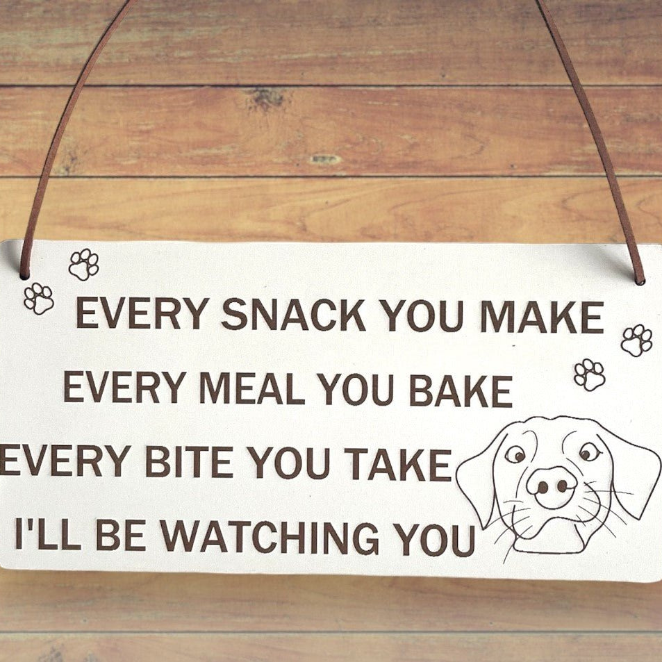 Plaque Size: 220 x 110 mm (approx) Thickness: 3mm Text reads: Every snack you make every meal you bake every bite you take i'll be watching you Suitable For: Dog Signs For Home, Gifts For Dog Lovers, Dog Signs And Plaques, Funny Dog Sign, Birthday Gift Style: Contemporary Material: White coated MDF with brown faux leather hanger Indoor use only Made in England