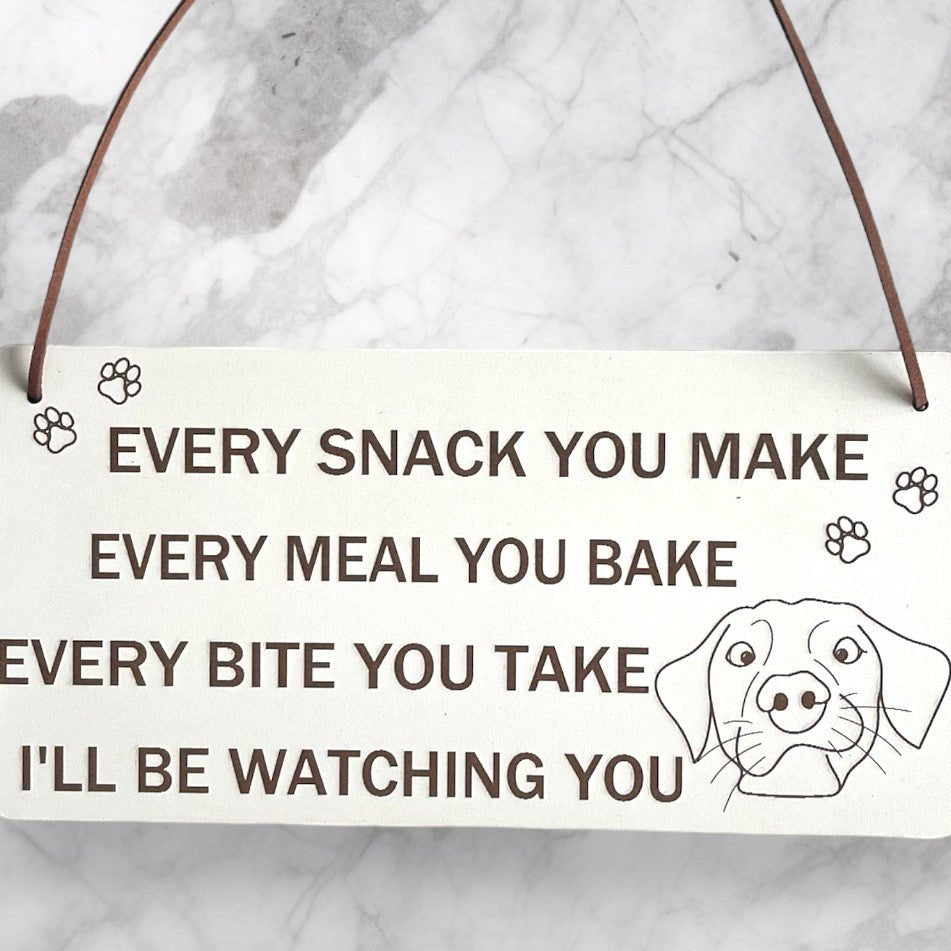 Plaque Size: 220 x 110 mm (approx) Thickness: 3mm Text reads: Every snack you make every meal you bake every bite you take i'll be watching you Suitable For: Dog Signs For Home, Gifts For Dog Lovers, Dog Signs And Plaques, Funny Dog Sign, Birthday Gift Style: Contemporary Material: White coated MDF with brown faux leather hanger Indoor use only Made in England