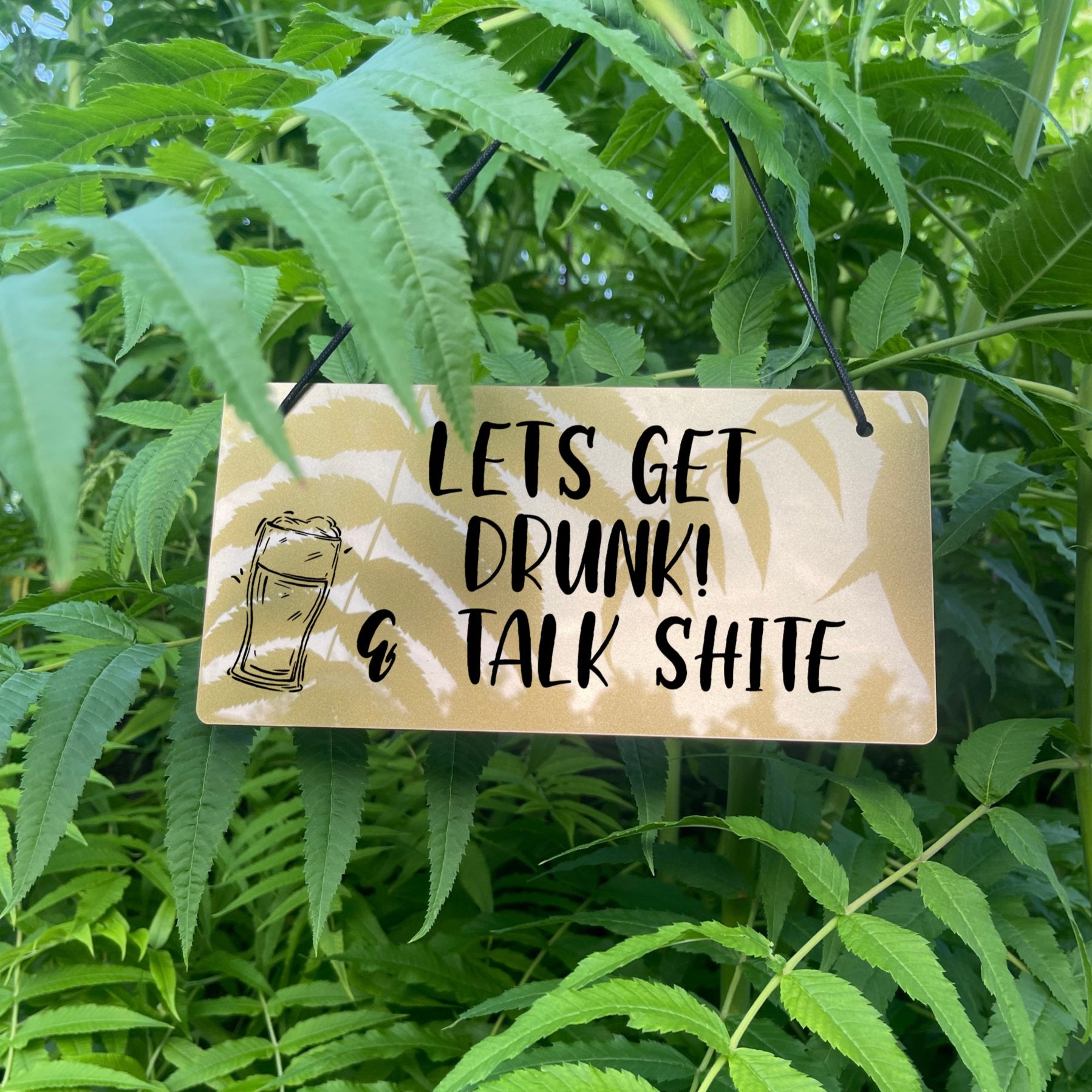 Funny engraved silver acrylic bar sign with Let’s Get Drunk quote – hanging with black twine