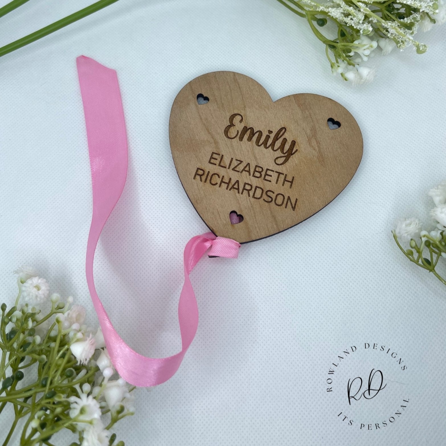 Personalised wooden baby announcement plaque with a balloon and heart design.