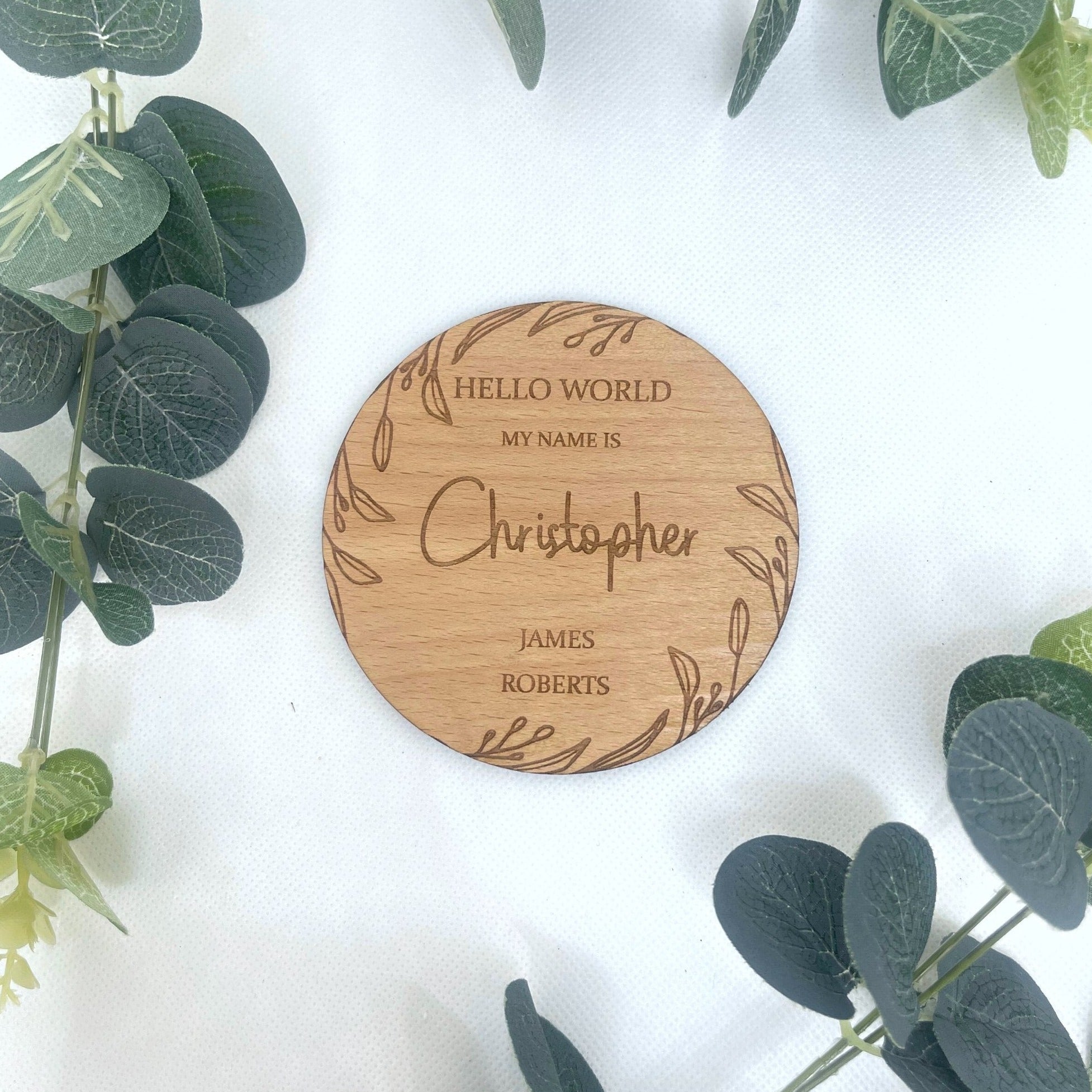 Personalised wooden baby announcement plaque with a boho leaf design.
