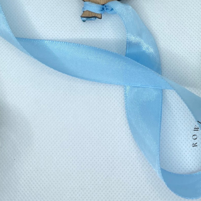 blue ribbon shown for balloon baby announcement