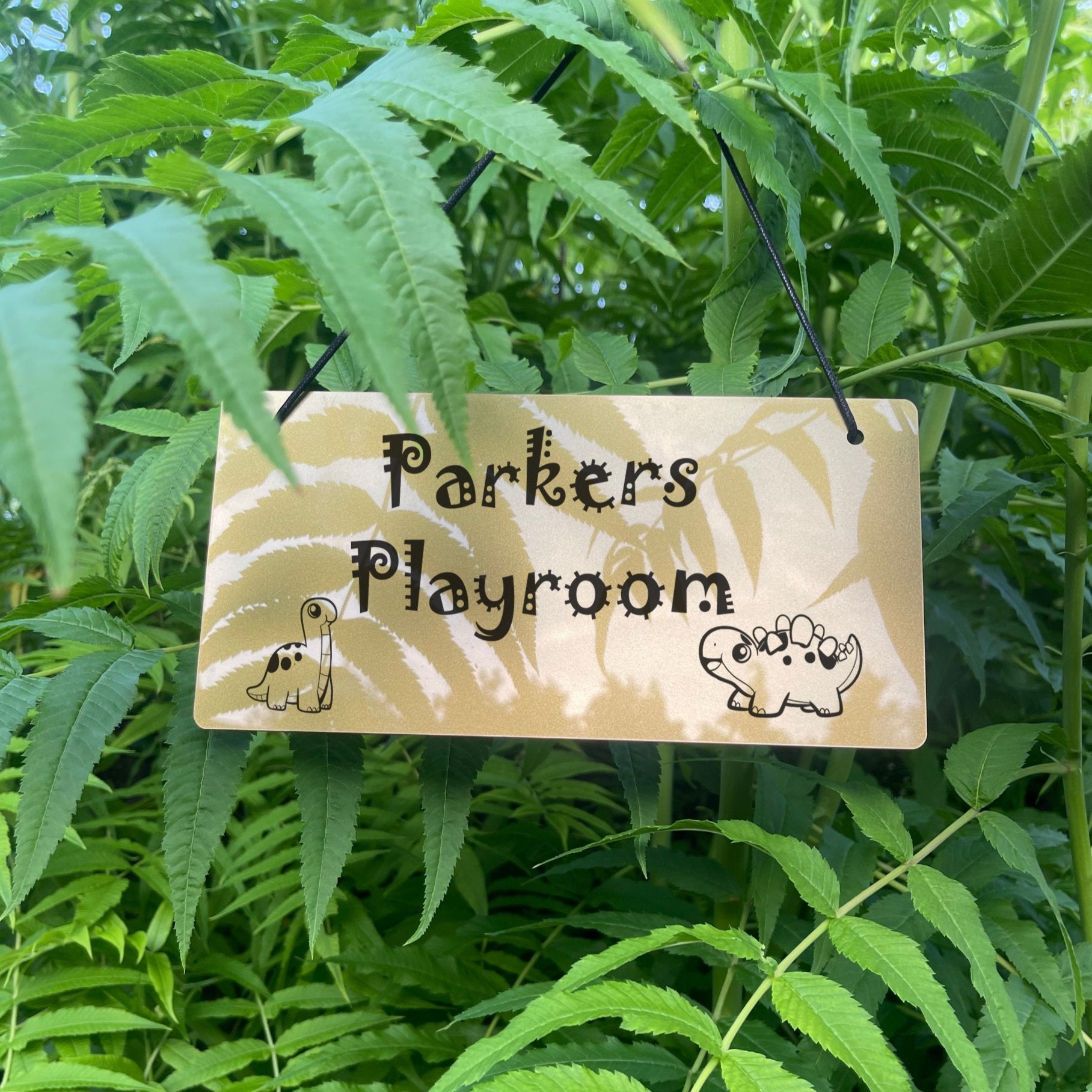 Personalised Dinosaur Playroom Sign with a custom name.