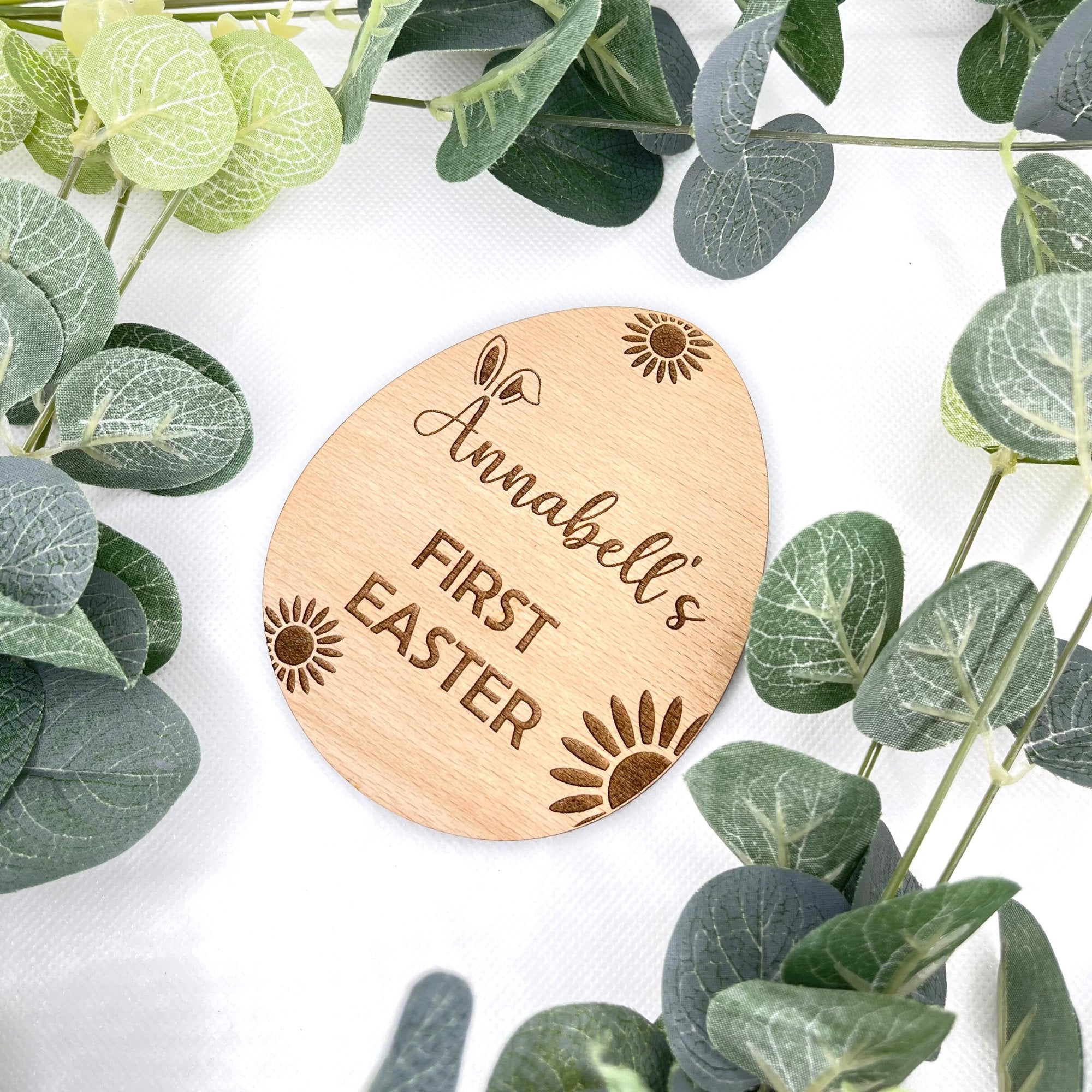 A personalised egg-shaped Easter plaque for a baby announcement with a custom name engraved.