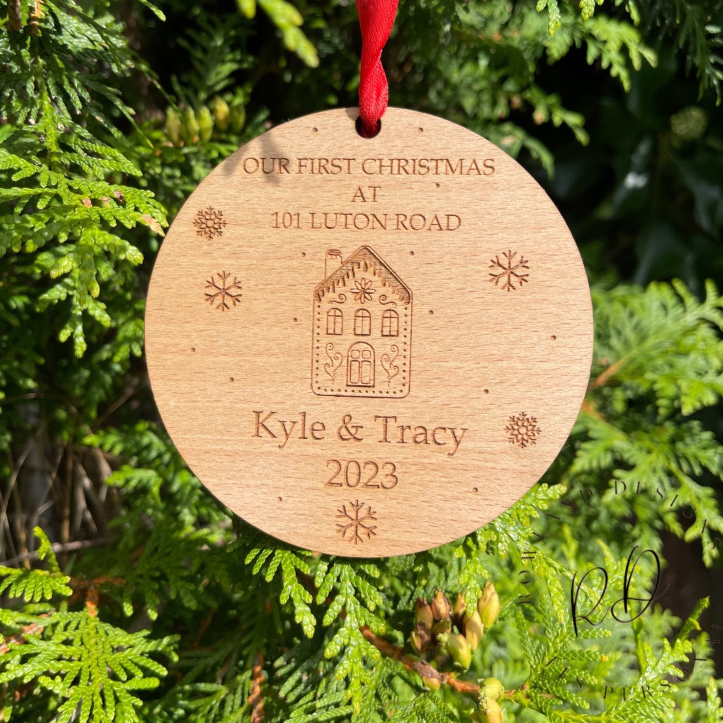 A personalised "First Home" Christmas ornament with the home and family's names engraved.