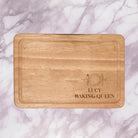 Add a personal touch to your kitchen with our Personalised Chopping Board Knife & Fork Design. Engrave two lines of text (max 20 characters each in caps) on this premium wood board, making it a stylish and thoughtful gift for housewarmings, weddings, or anniversaries. Versatile for day-to-day and special occasions, this board enhances your cooking experience with personalized perfection.