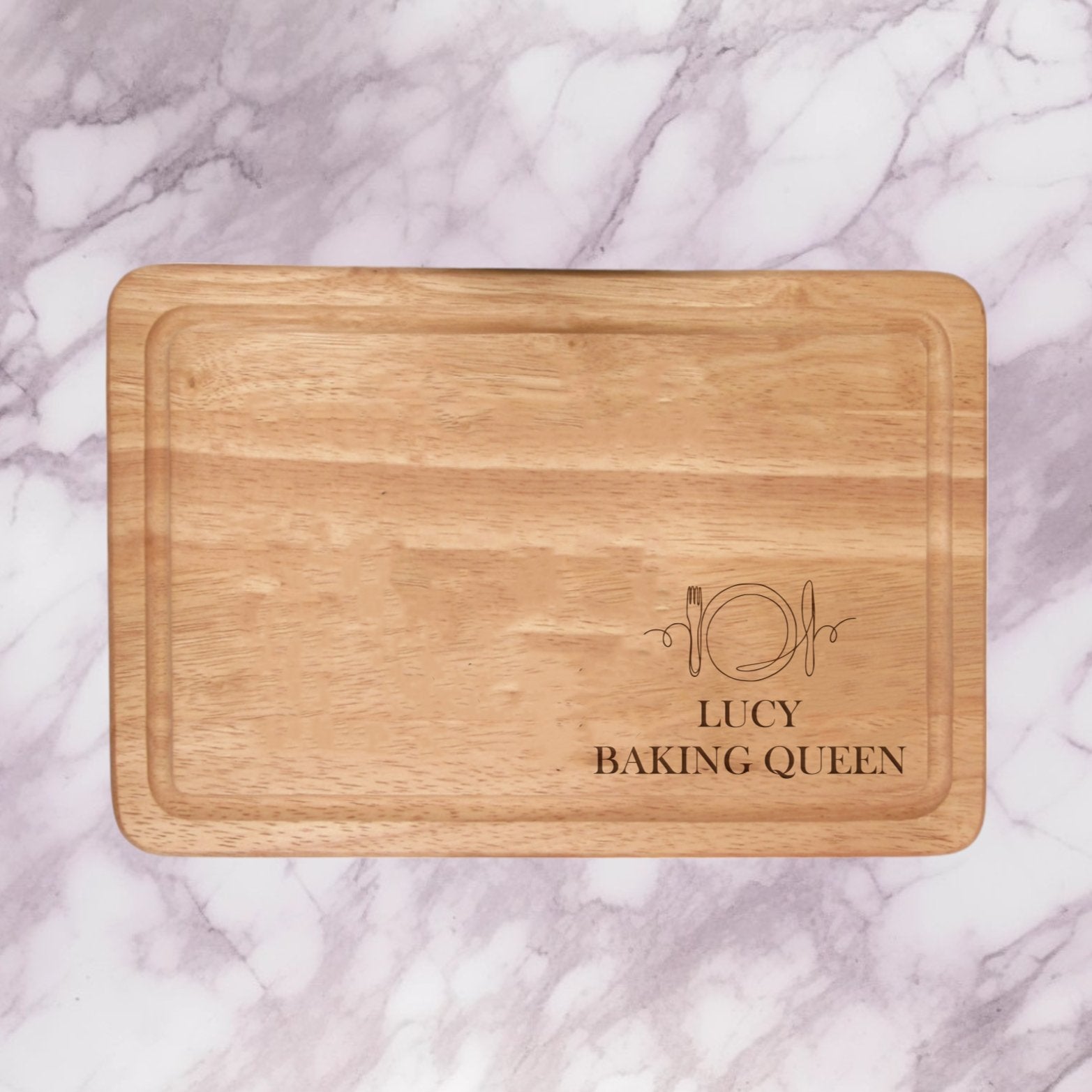 Add a personal touch to your kitchen with our Personalised Chopping Board Knife & Fork Design. Engrave two lines of text (max 20 characters each in caps) on this premium wood board, making it a stylish and thoughtful gift for housewarmings, weddings, or anniversaries. Versatile for day-to-day and special occasions, this board enhances your cooking experience with personalized perfection.