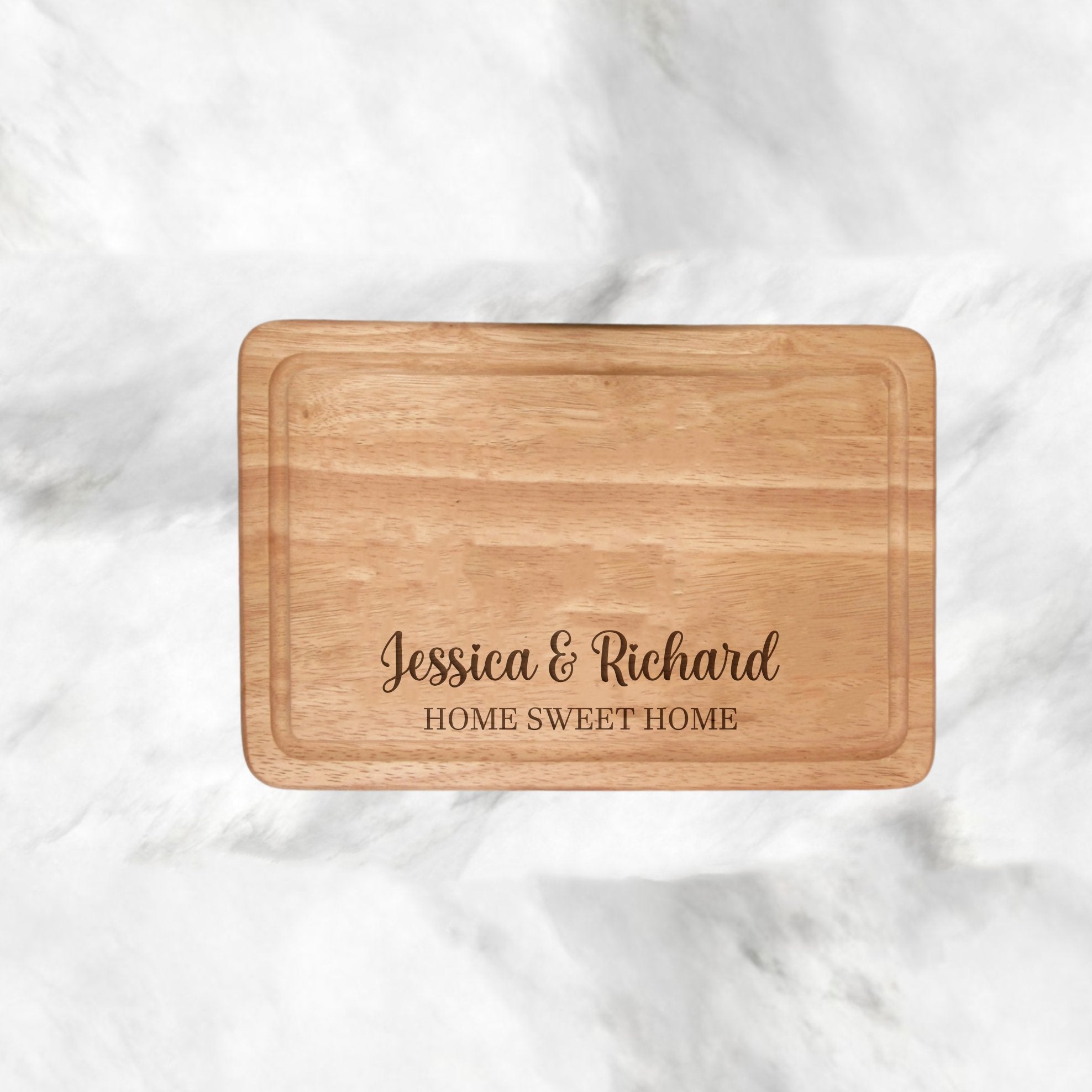 Personalised Chopping Board - Home Sweet Home
Customise your space with our unique chopping board. Add names to the top line, and ‘Home Sweet Home’ comes standard on this item. Create a meaningful home, tailored to you and your family. Our personalised chopping board allows you to add names and special sayings, making it truly unique. Home Sweet Home comes standard with every board.