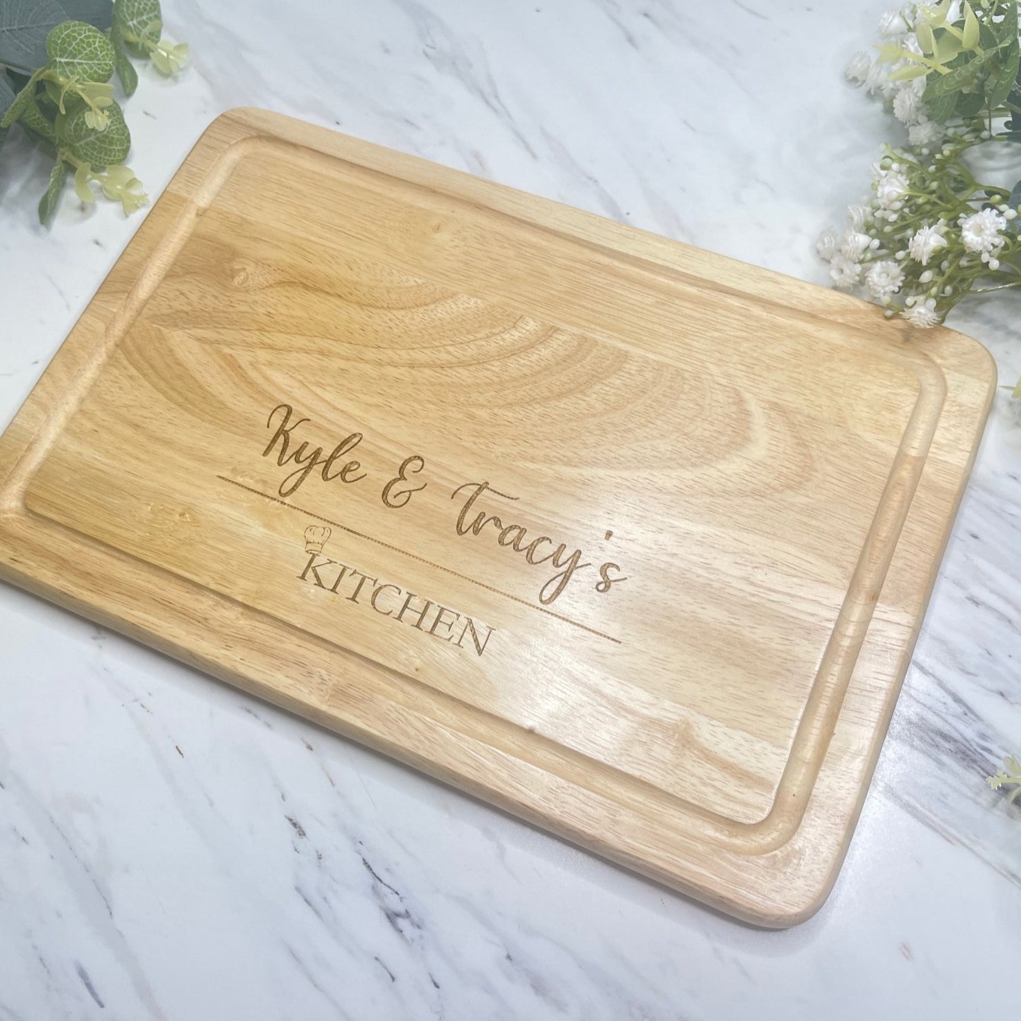 Personalised Engraved Wooden Chopping Board, shown on kitchen worktop, engraved.