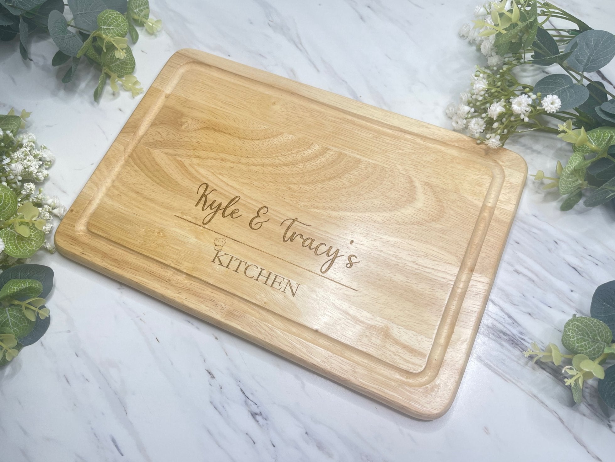 Personalised Engraved Wooden Chopping Board, shown on kitchen worktop, engraved.