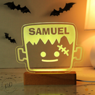 Halloween-themed lamp with 'SAMUEL' on a wooden base, surrounded by decorative bats.