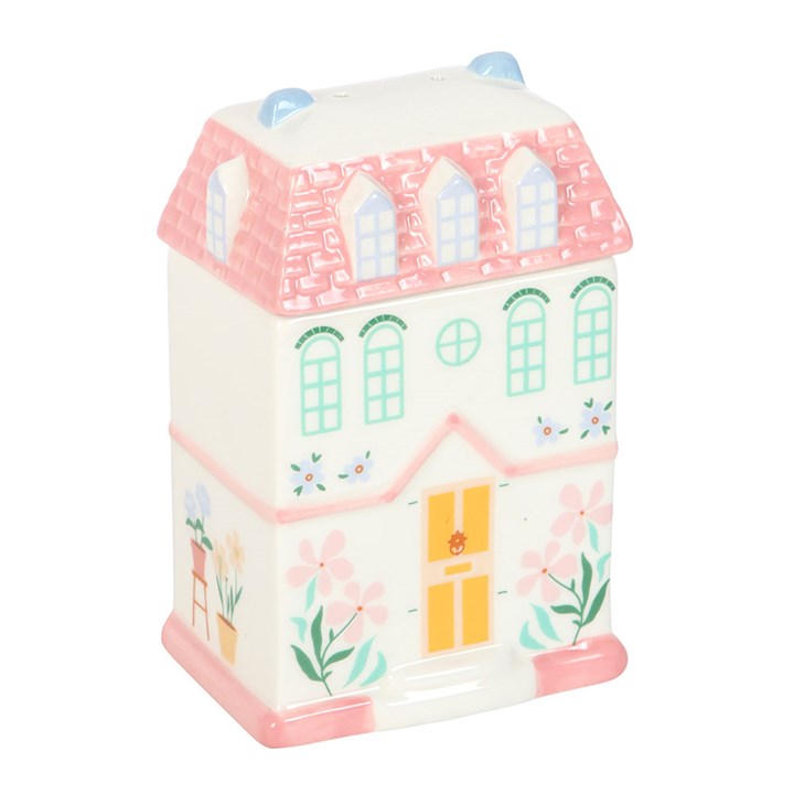 A beautifully crafted pastel pink ceramic fragrance warmer in a house shape, designed for wax melts or essential oils. Adds a stylish and aromatic touch to any room.