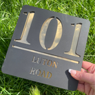 showing the house sign close up to see its beautiful colours 