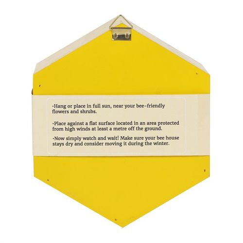 Back view of the wooden bee hotel, showcasing its yellow design and natural materials.
