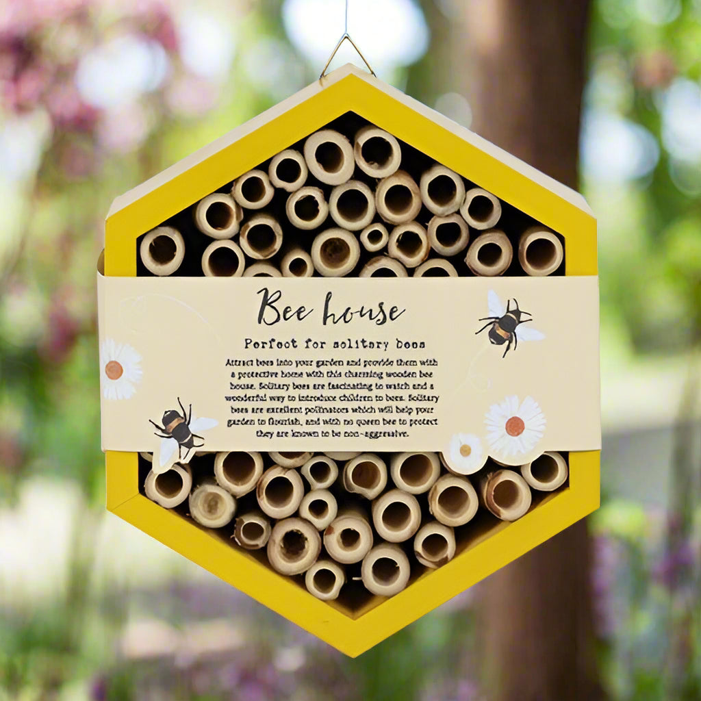 Rustic design of the bee hotel, blending naturally into garden decor.