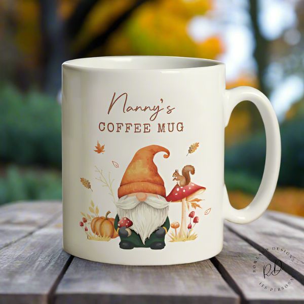 Charming ceramic mug with personalised text and cute autumn gonk illustration, perfect gift for fall lovers
