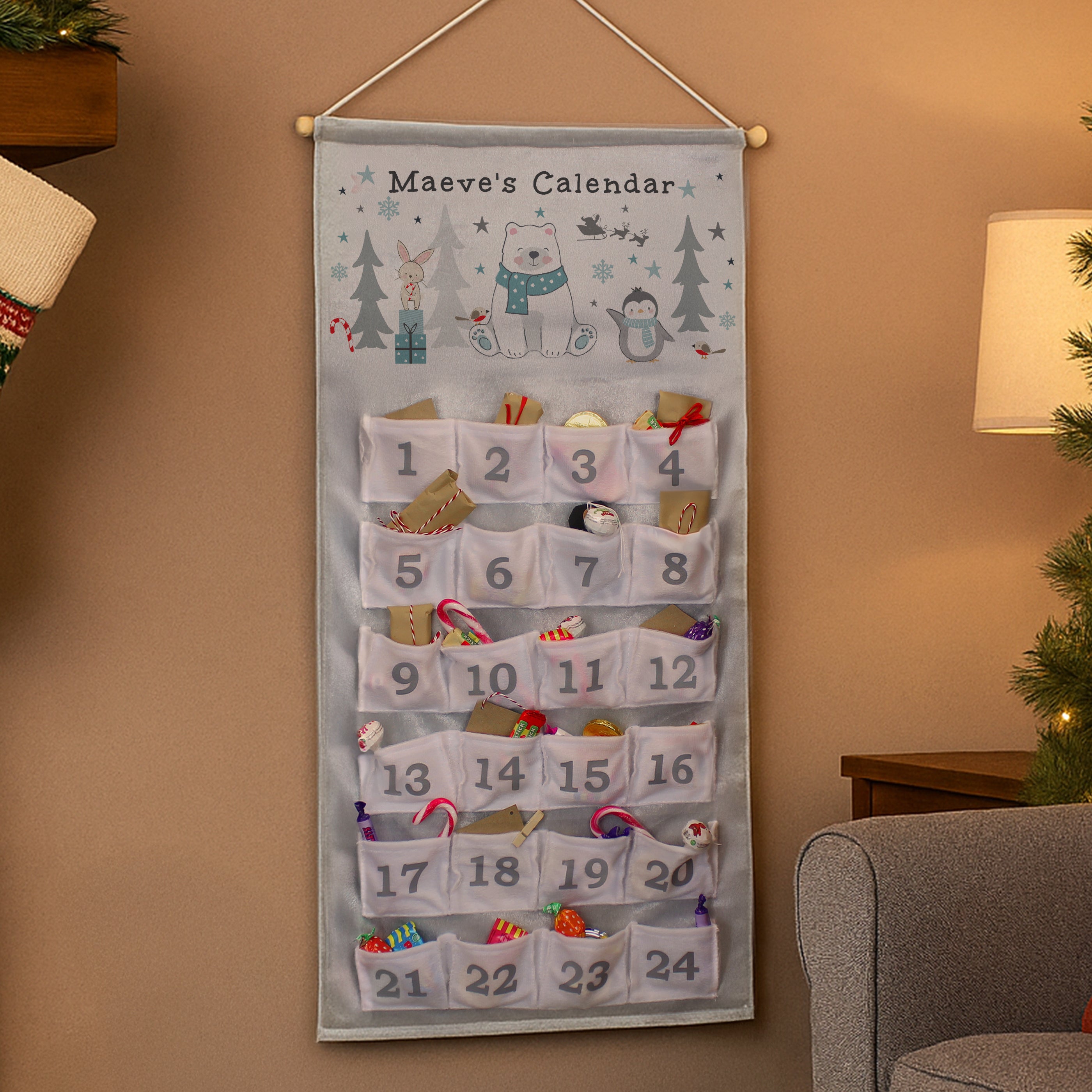 Personalised polar bear advent calendar hung on a wall as Christmas decoration.
