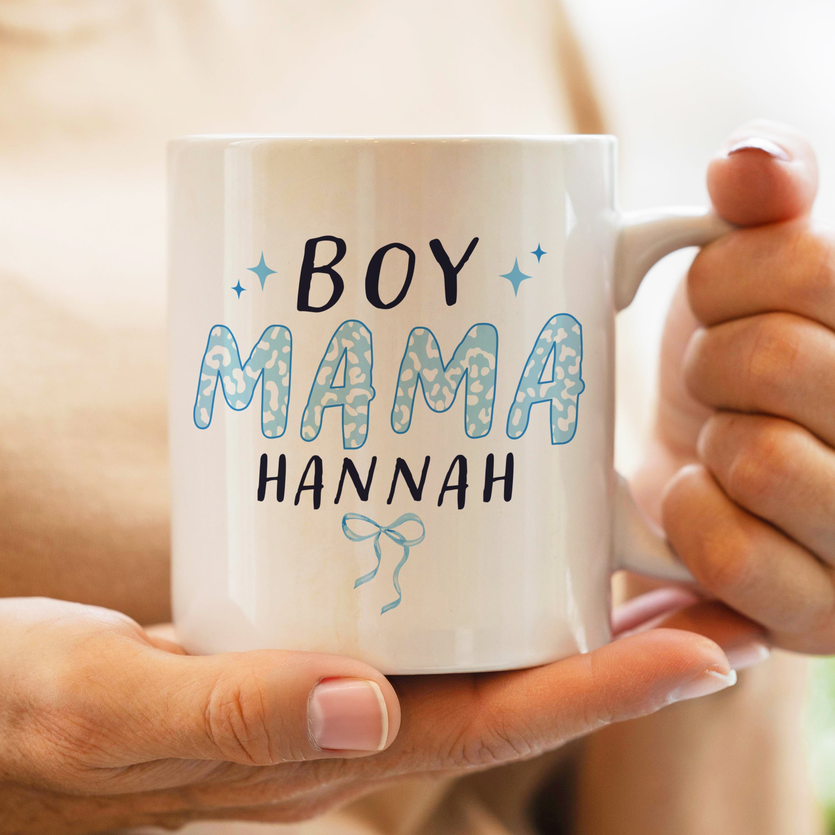 Person holding a mug with 'BOY MAMA HANNAH' text