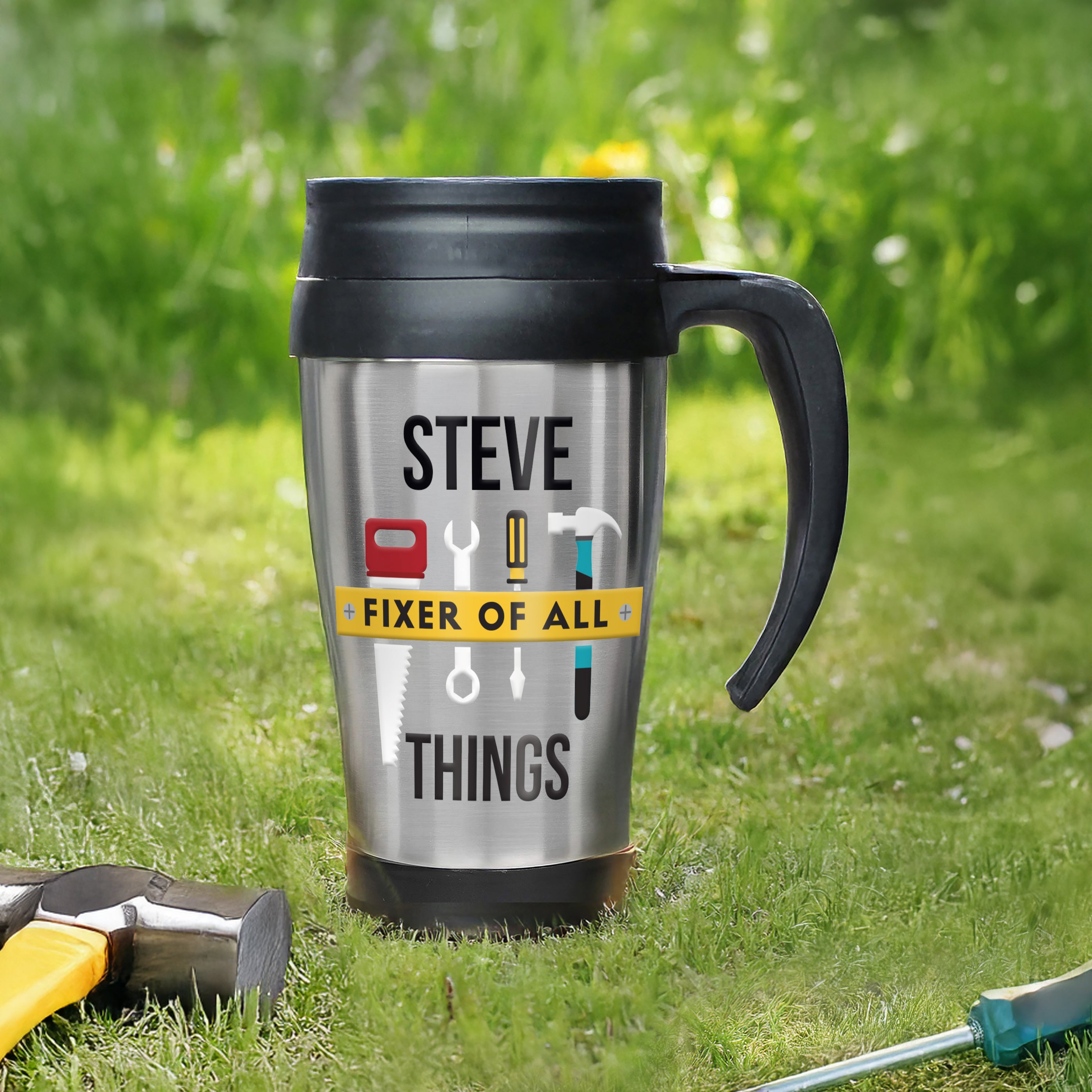 Travel mug with 'Steve Fixer of All Things' text on grass