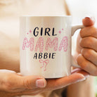 White mug with 'Girl Mama Abbie' text held by a person
