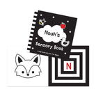 High contrast baby book with child’s name on cover